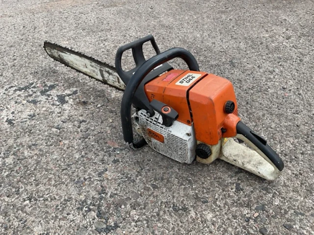 A Stihl petrol powered chain saw - model 044, with long 25in blade.