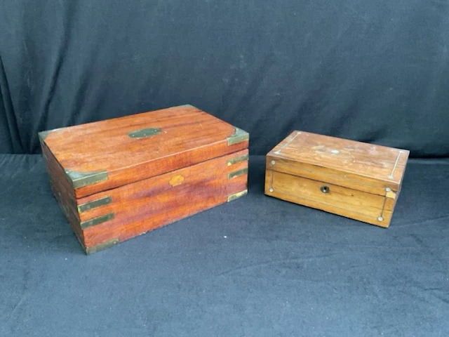 A Victorian mahogany writing slope with side drawer, having brass
