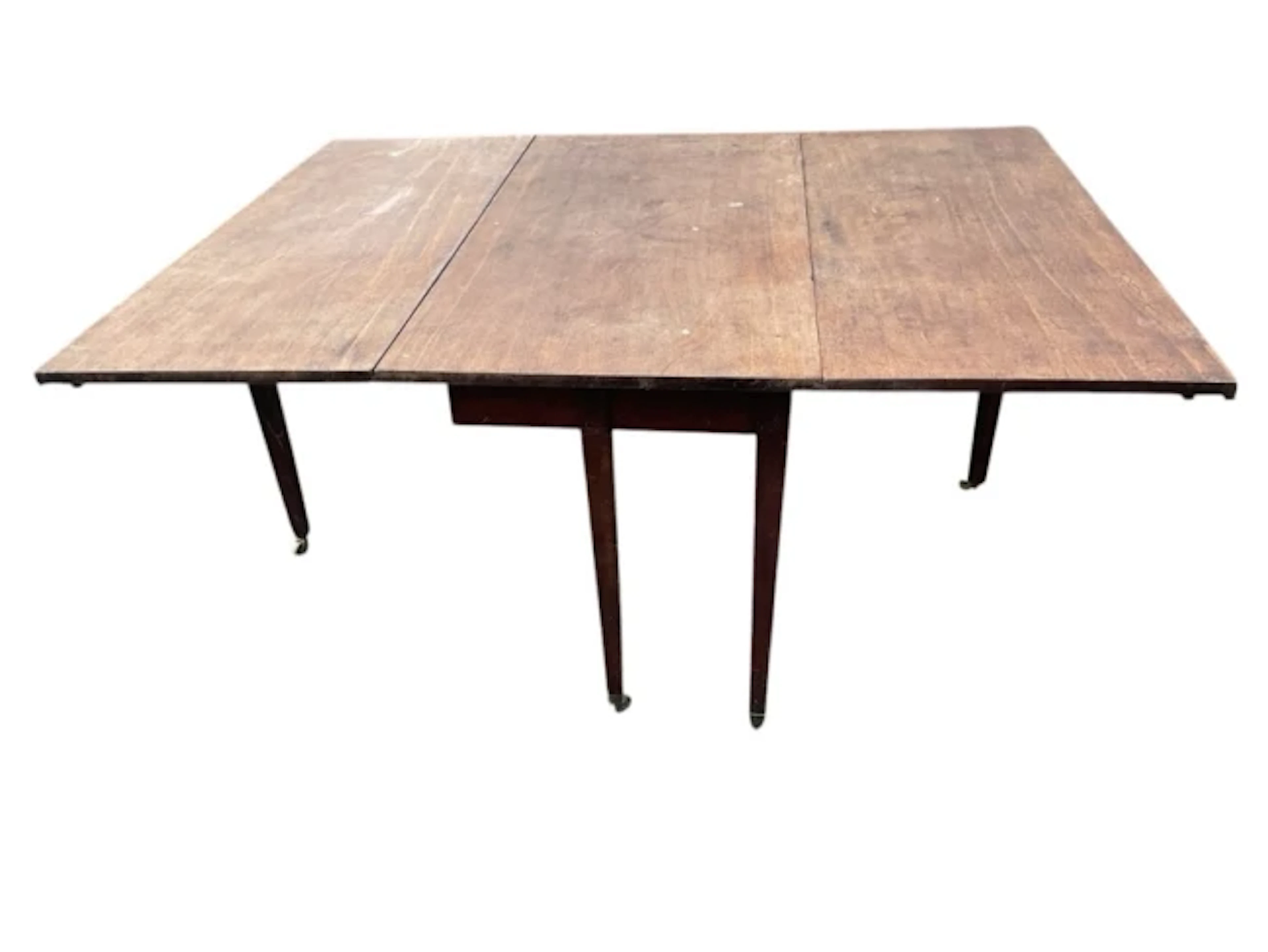 A Georgian mahogany dining table with two rule-jointed drop leaves