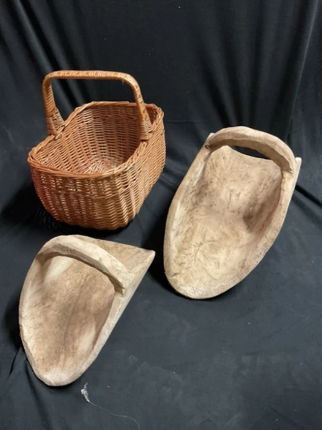 Two flower trugs carved from the solid; and a rectangular cane shopping