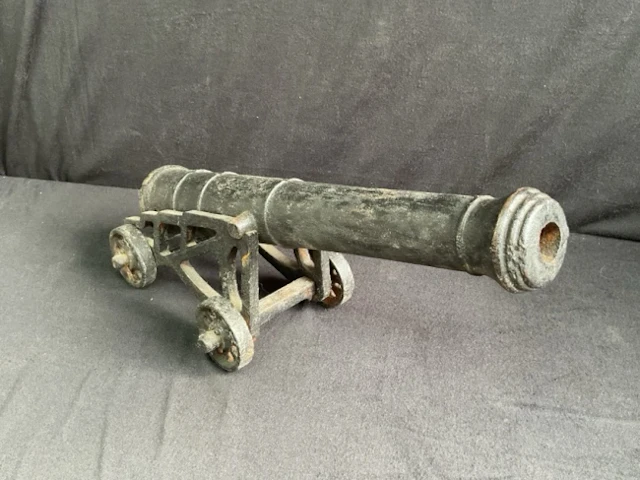 A Victorian style cast iron model naval canon, with tapered barrel