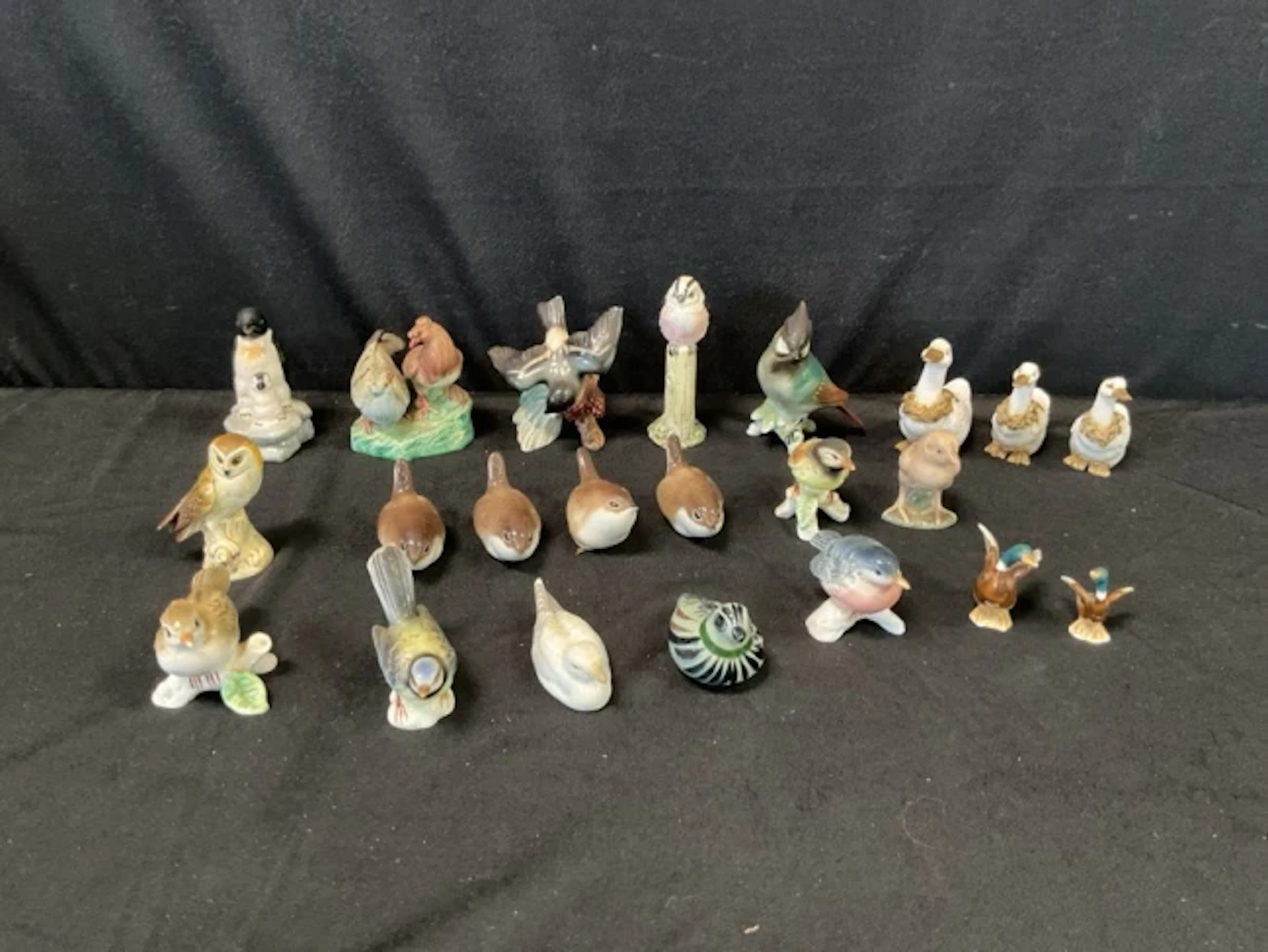 A collection of small ceramic birds incy, ducks, doves, Gobel owl