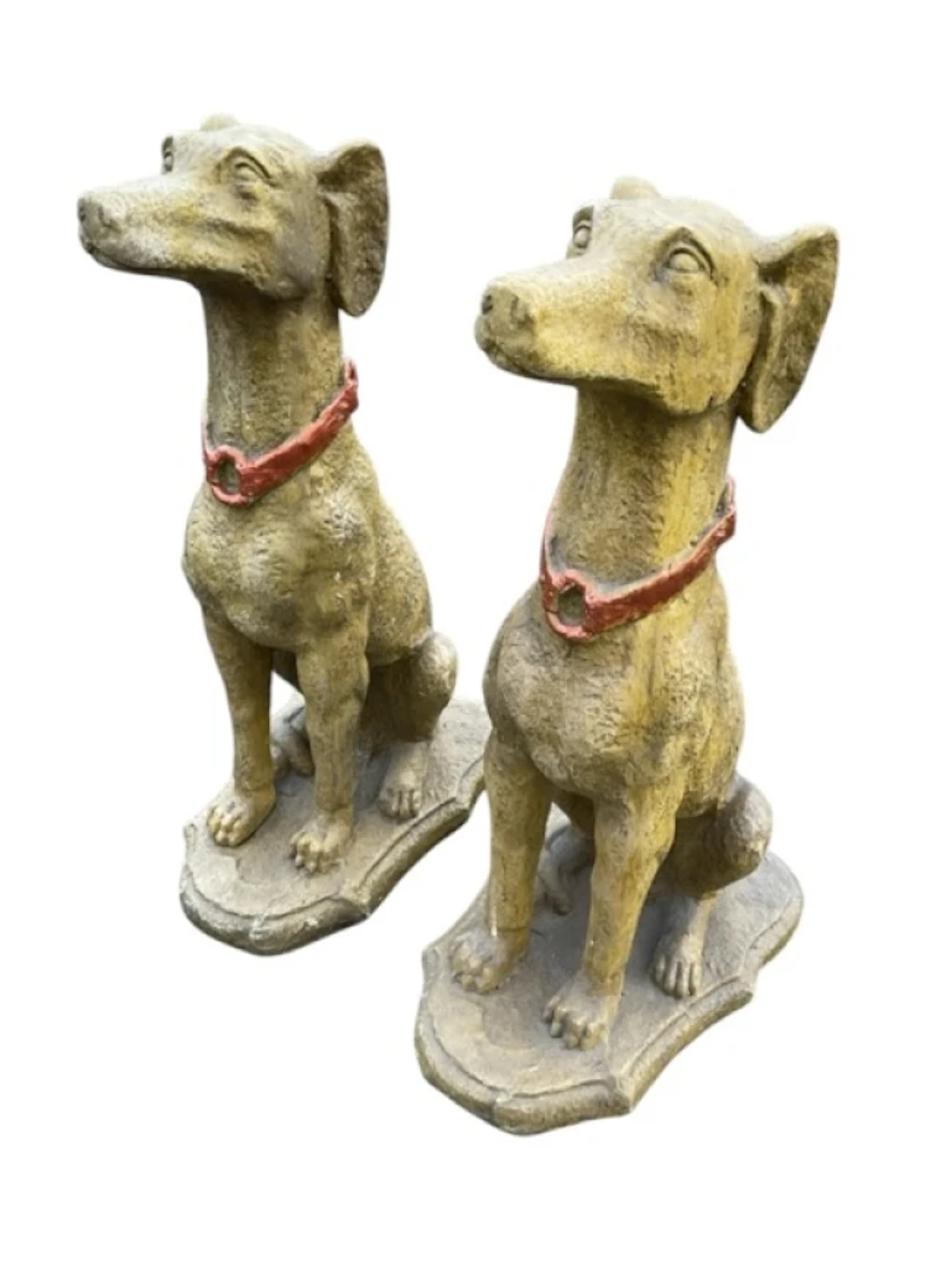A pair of painted composition dogs, the pround animals seated on their