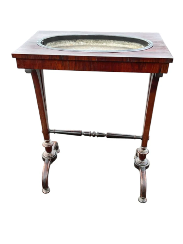 A William IV rosewood crocus table with rectangular top having recessed