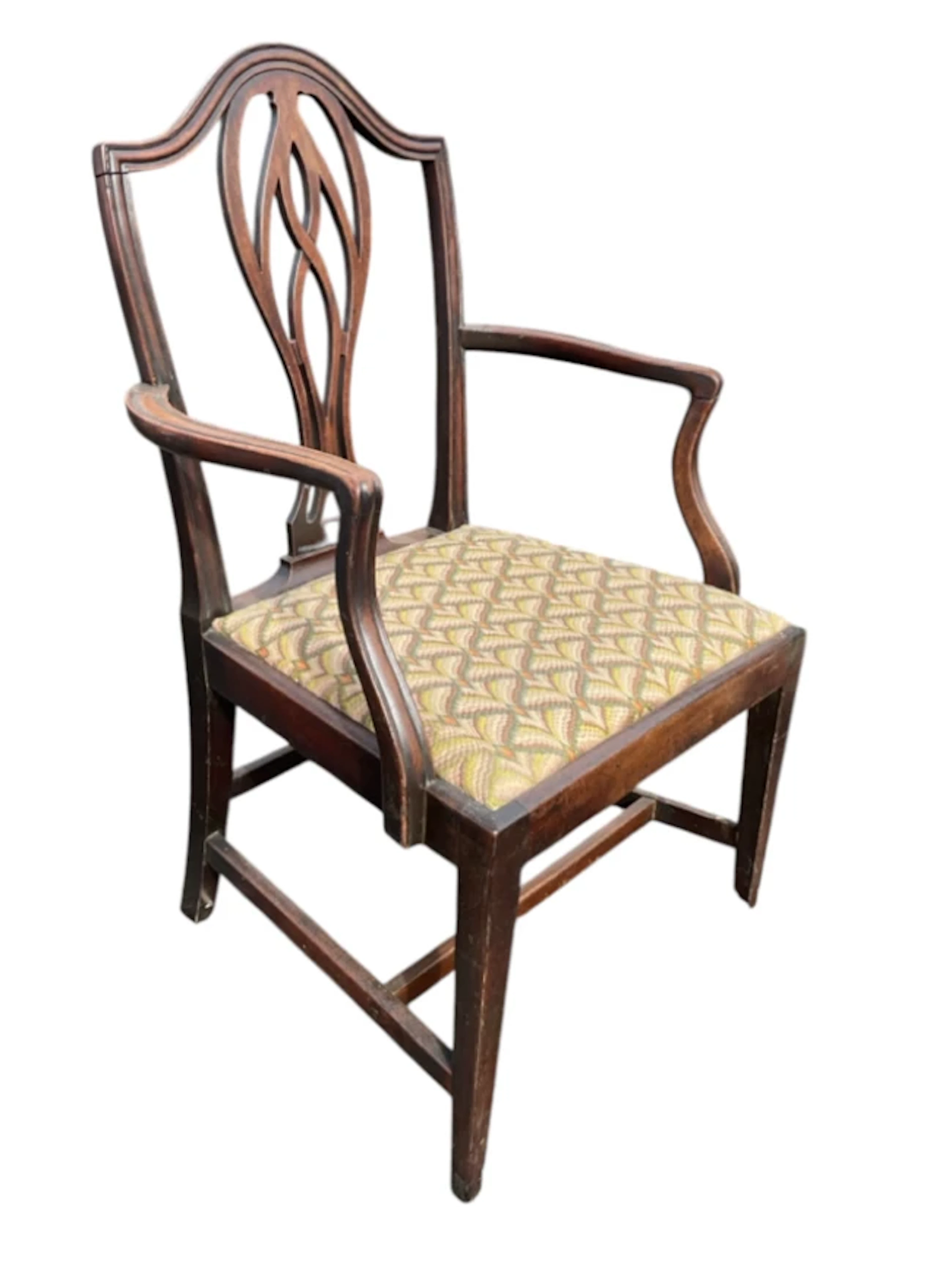 A Hepplewhite style C19th elbow chair with arched moulded back and