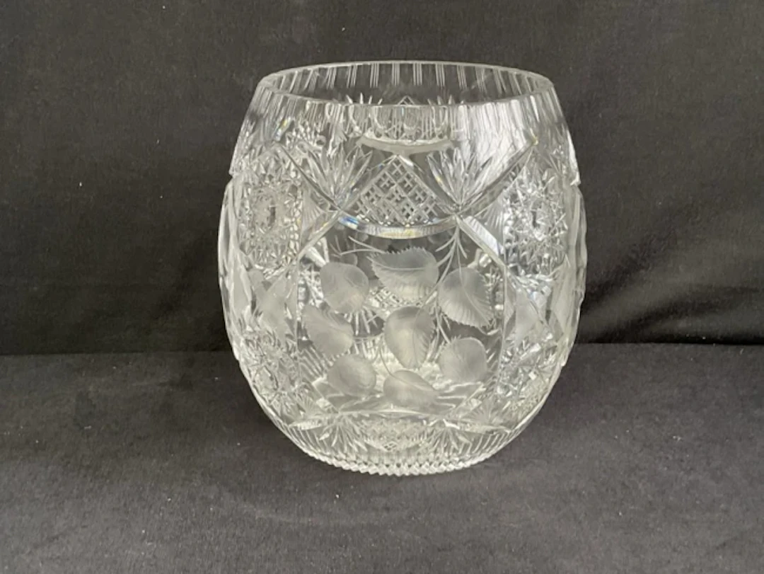 A large Bohemian ovoid cut crystal vase decorated with panels of fruit