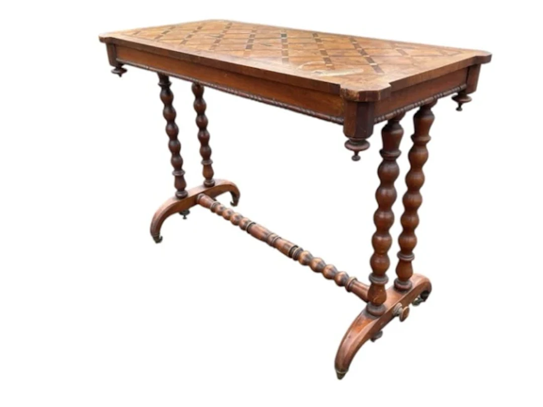 A rectangular Victorian walnut centre table with geometric parquetry