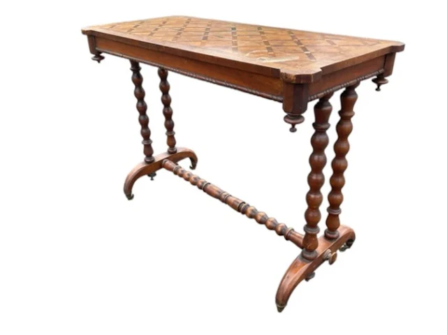 A rectangular Victorian walnut centre table with geometric parquetry
