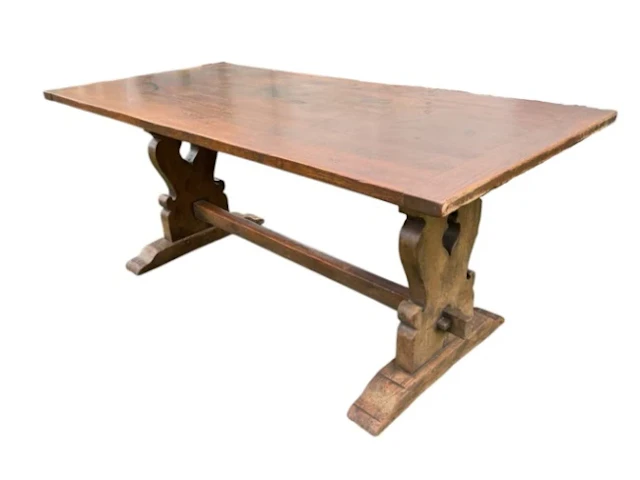 A 6ft oak refectory table with rectangular cleated top on pierced