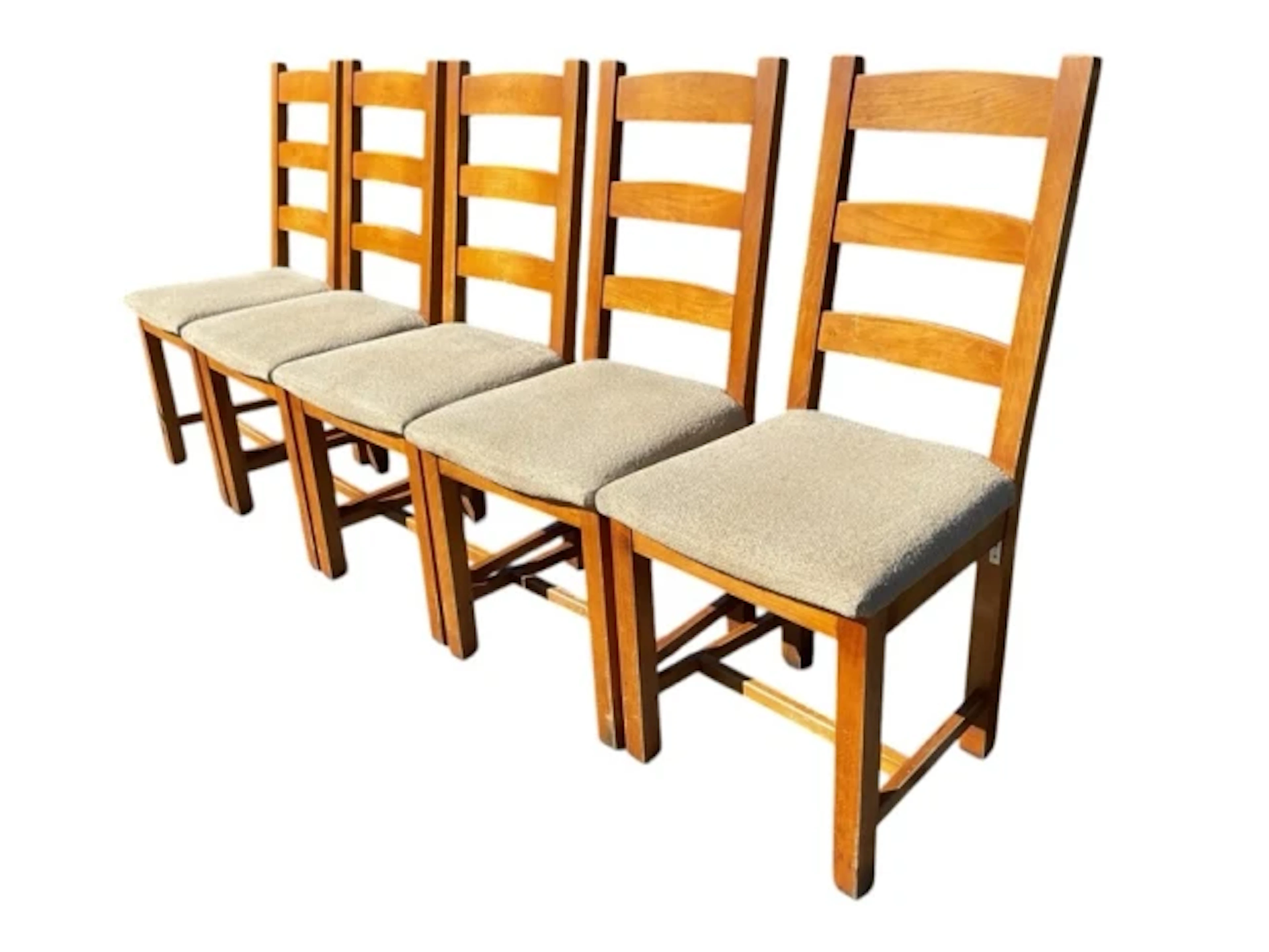 A set of five beech ladderback dining chairs with stuffover upholstered