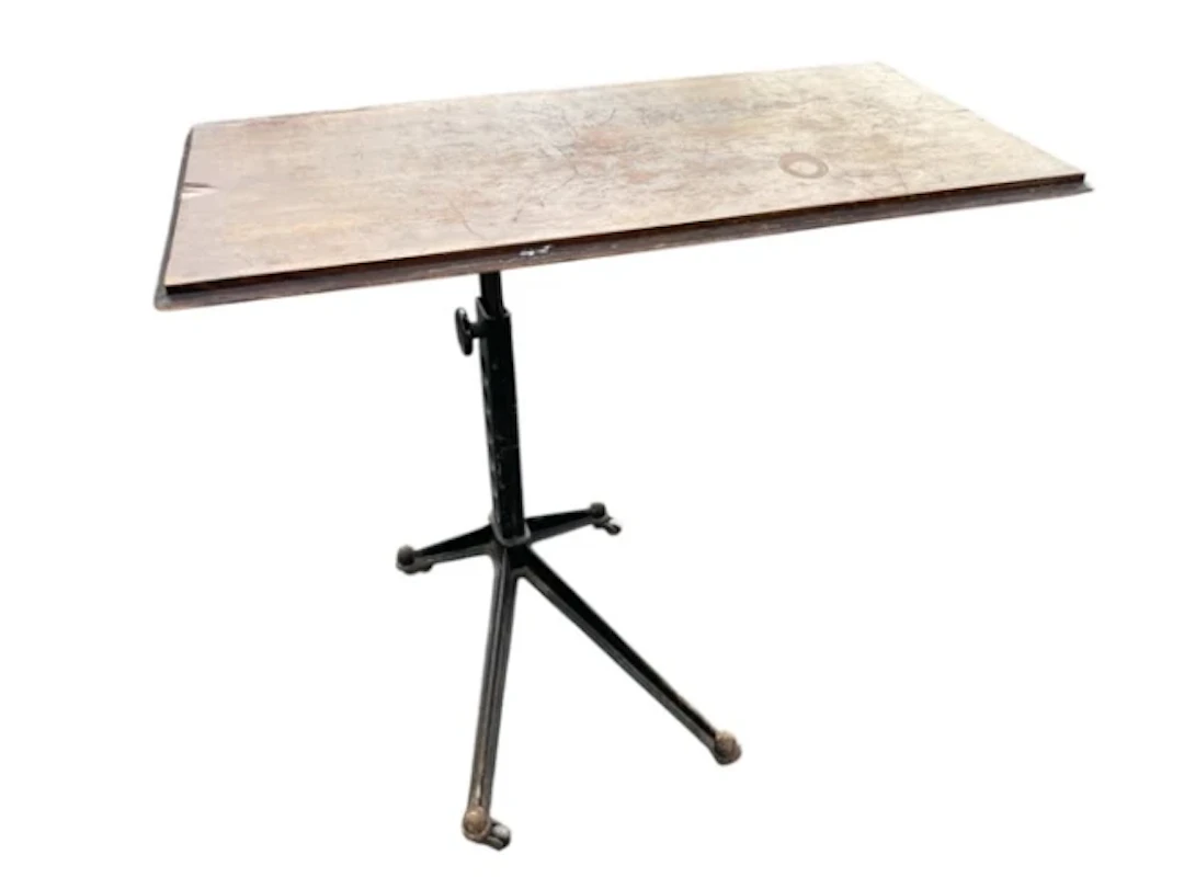 An Edwardian adjustable cast iron table, with rectangular top on stand