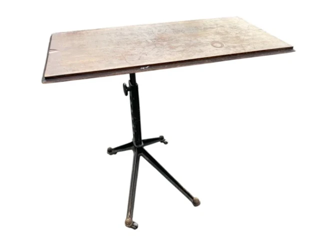 An Edwardian adjustable cast iron table, with rectangular top on stand