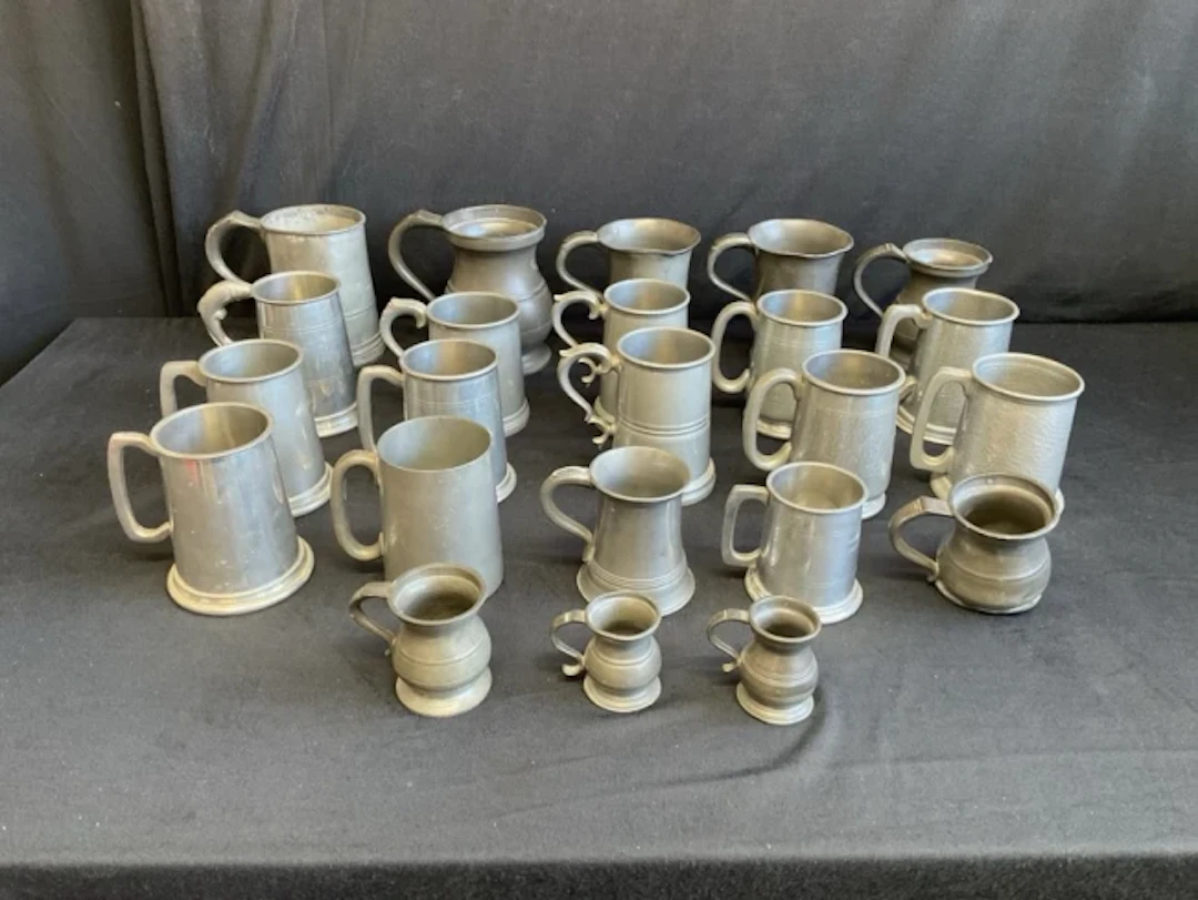 A collection of miscellaneous pewter tankards - hammered, some C19th