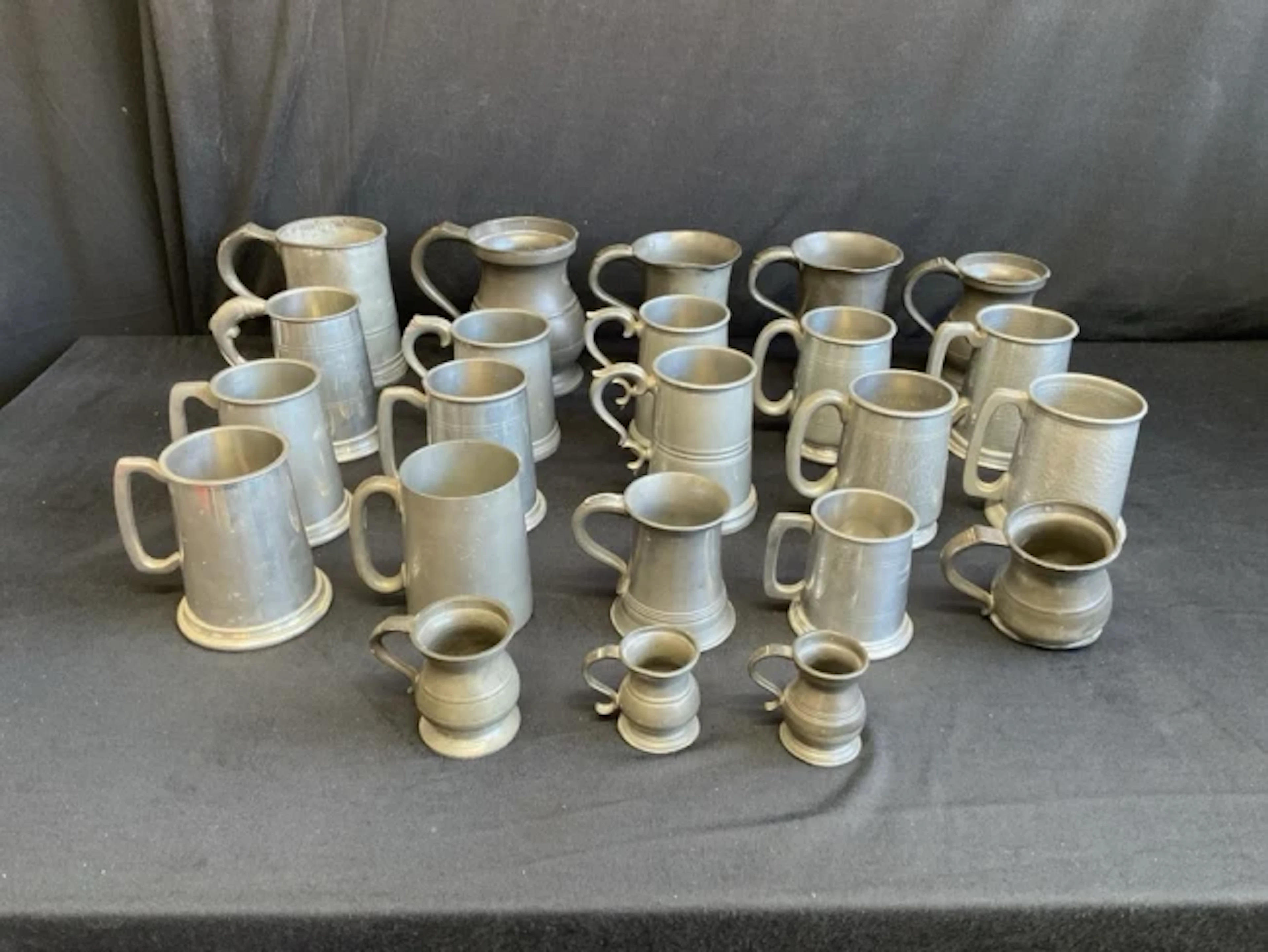 A collection of miscellaneous pewter tankards - hammered, some C19th