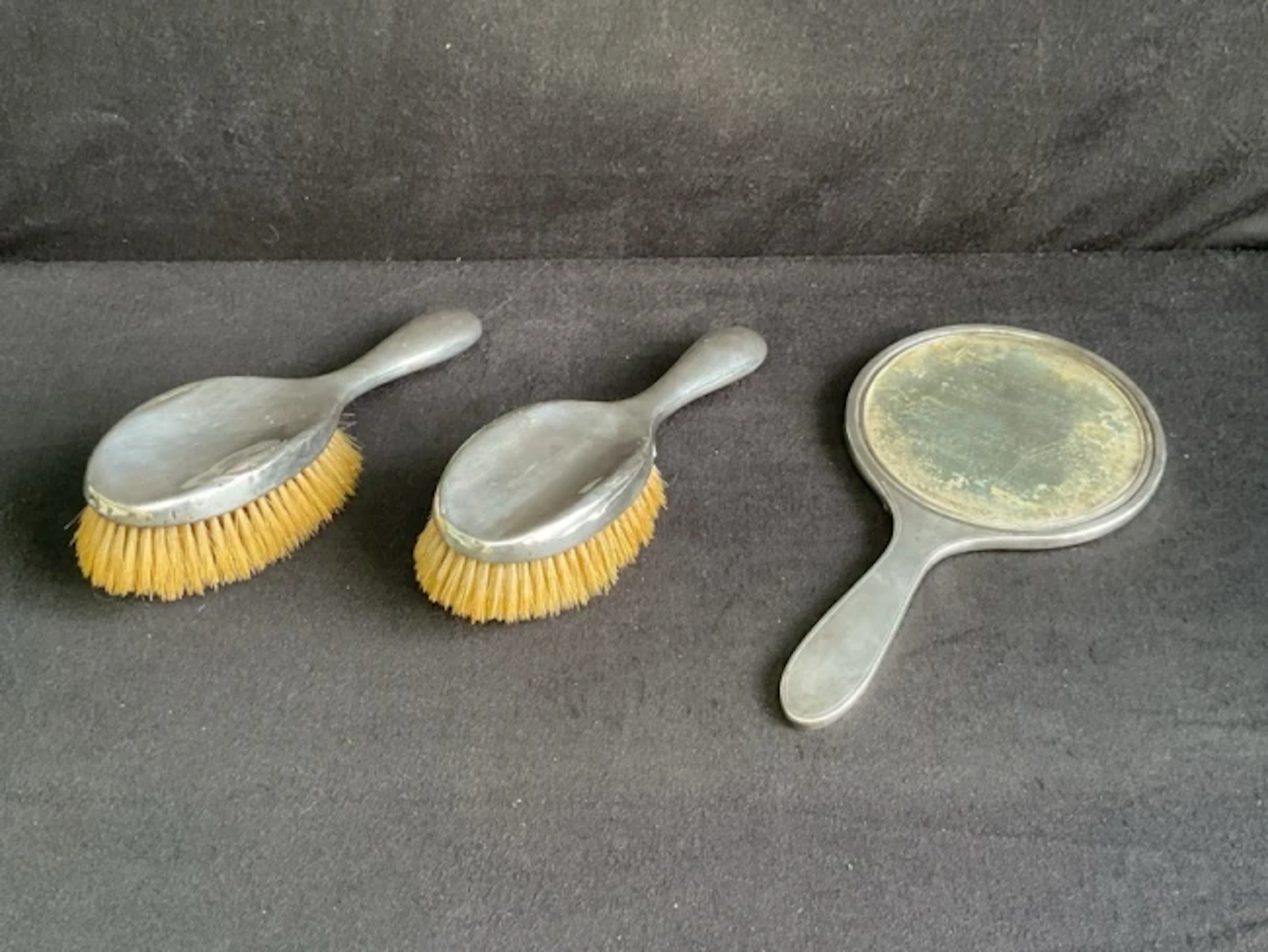 A pair of hallmarked silver-backed ladies hairbrushes by William Neale
