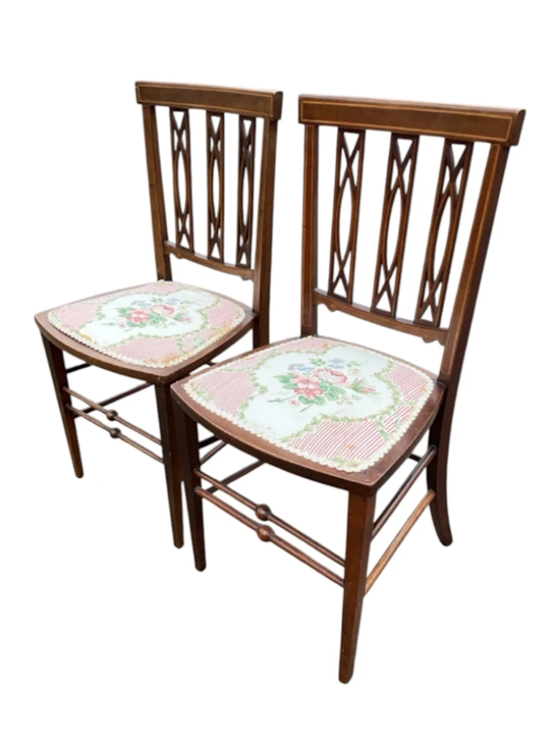 A pair of Edwardian boxwood strung mahogany chairs with tablet backs