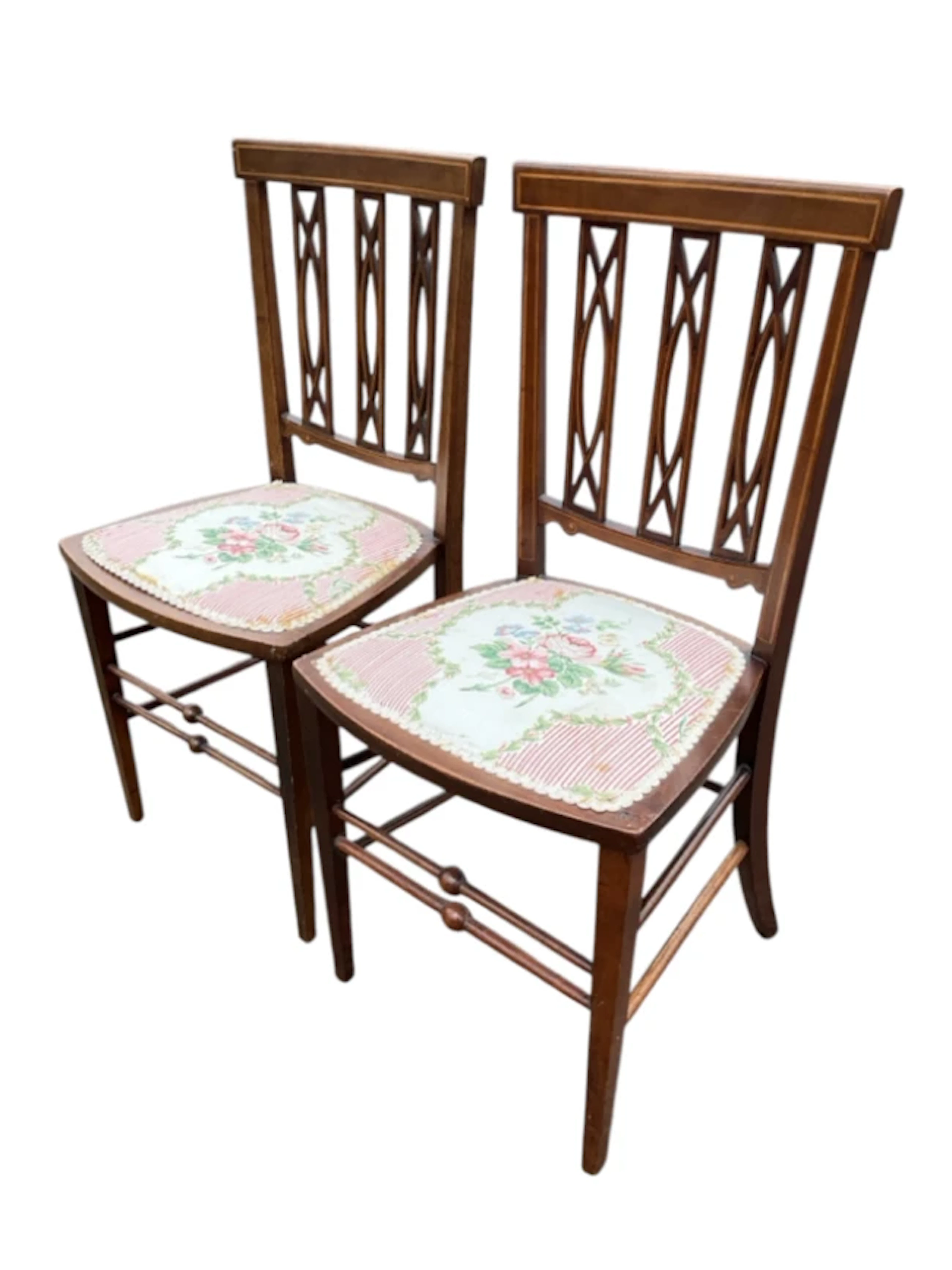 A pair of Edwardian boxwood strung mahogany chairs with tablet backs