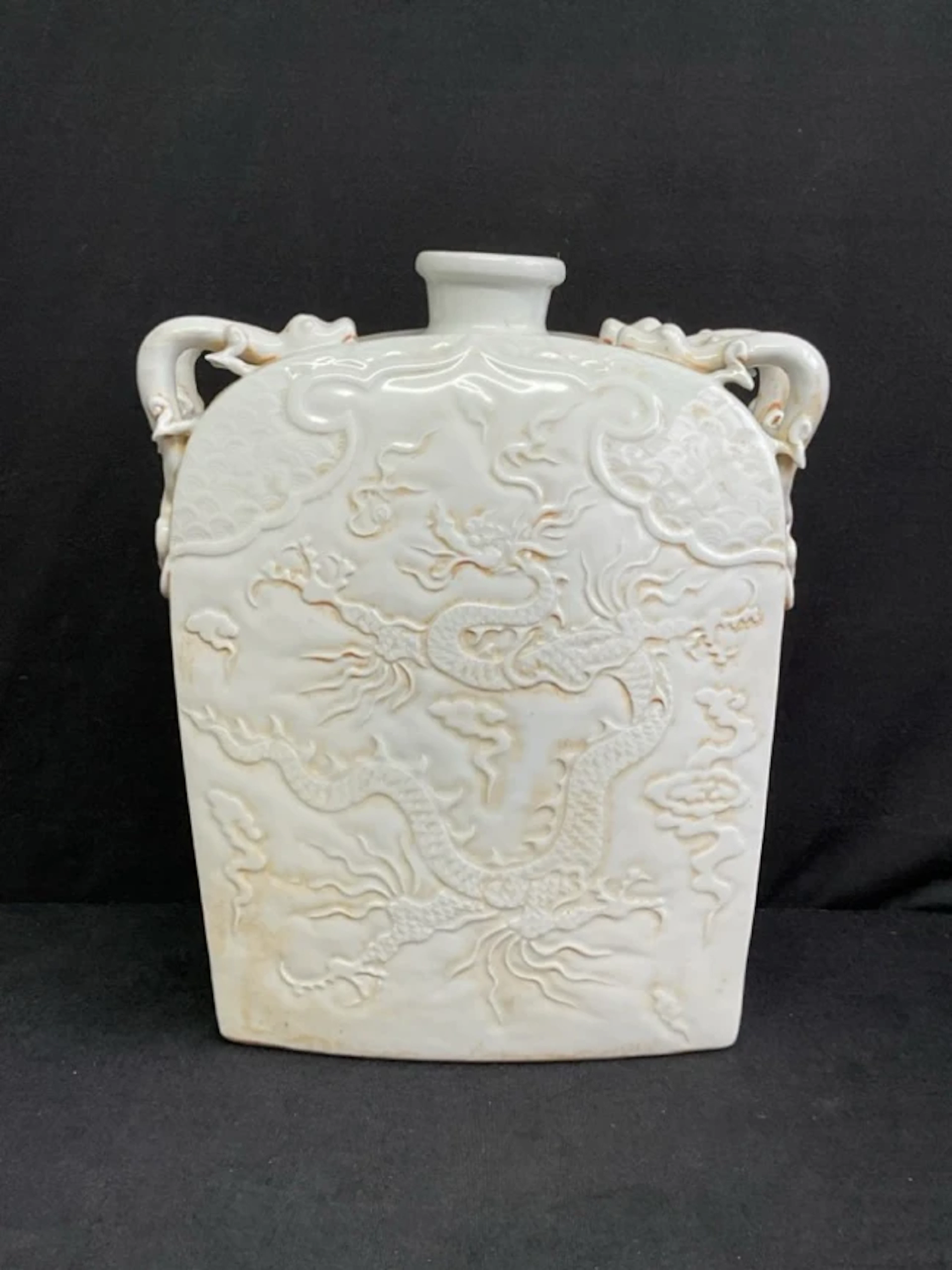 A Chinese Yuan Qingbai style pale celadon glazed stoneware wine flask