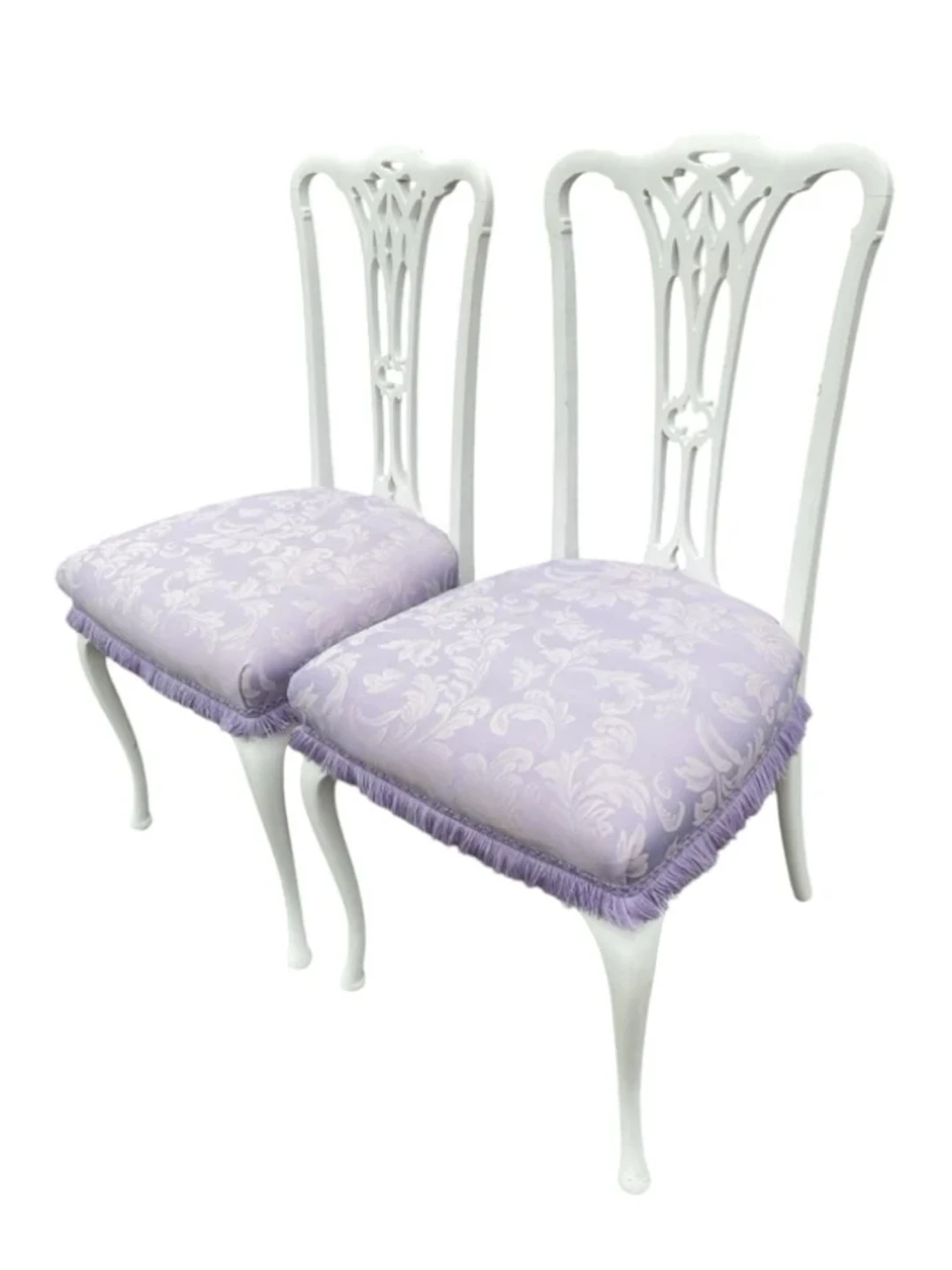 A pair of painted Edwardian chairs with pierced carved splats above