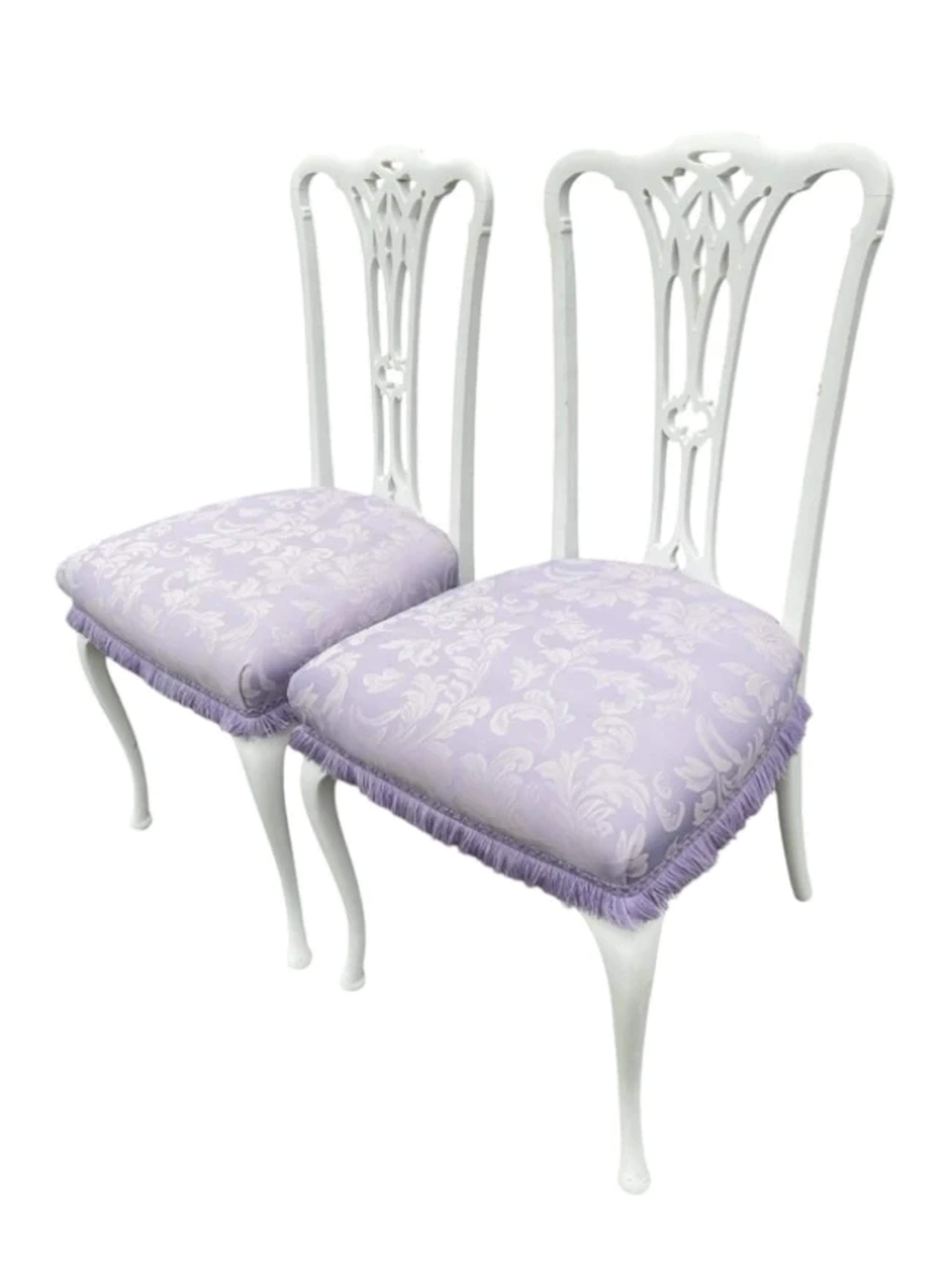 A pair of painted Edwardian chairs with pierced carved splats above