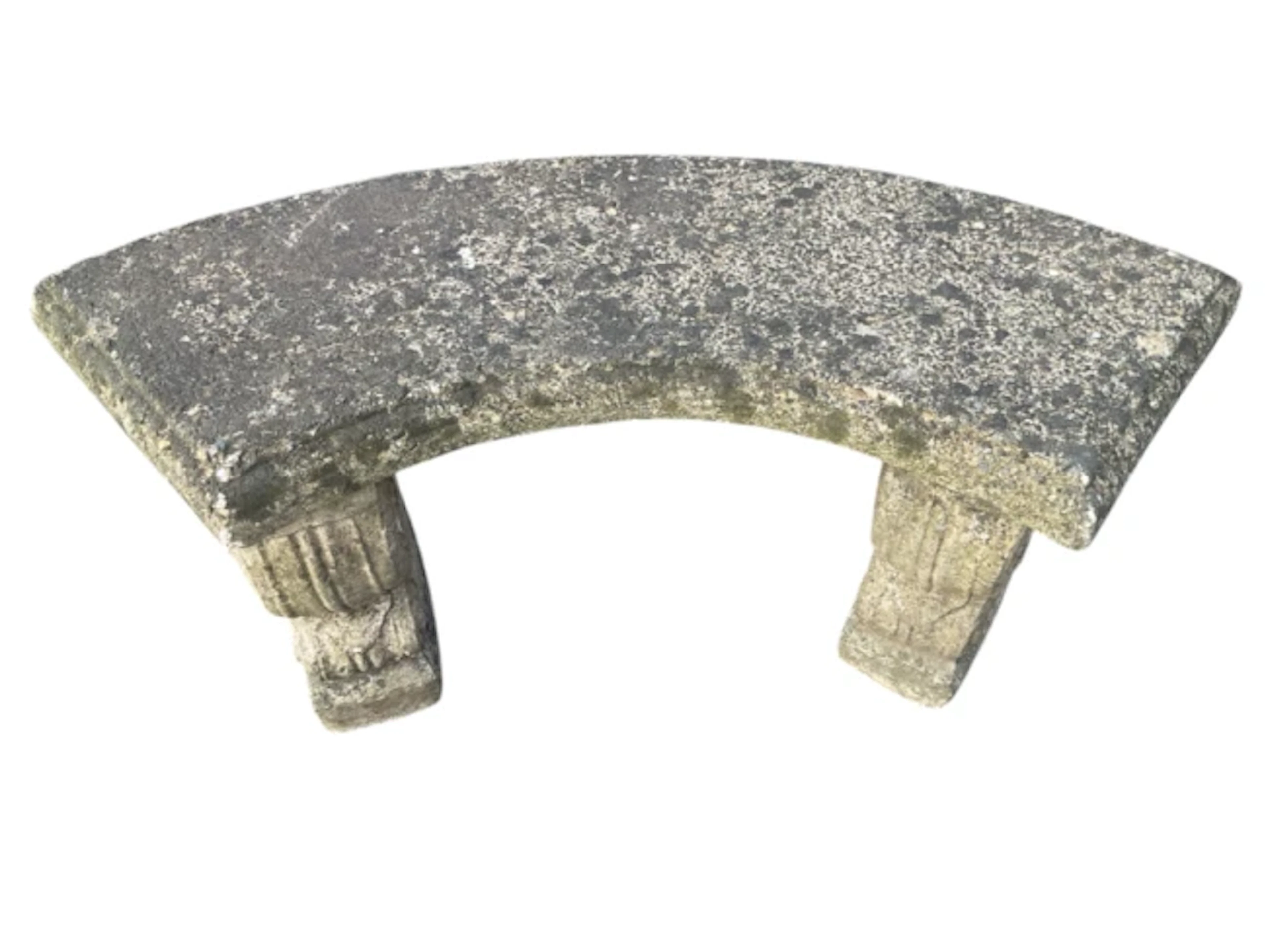 A composition stone garden bench of crescent shape, the moulded slab