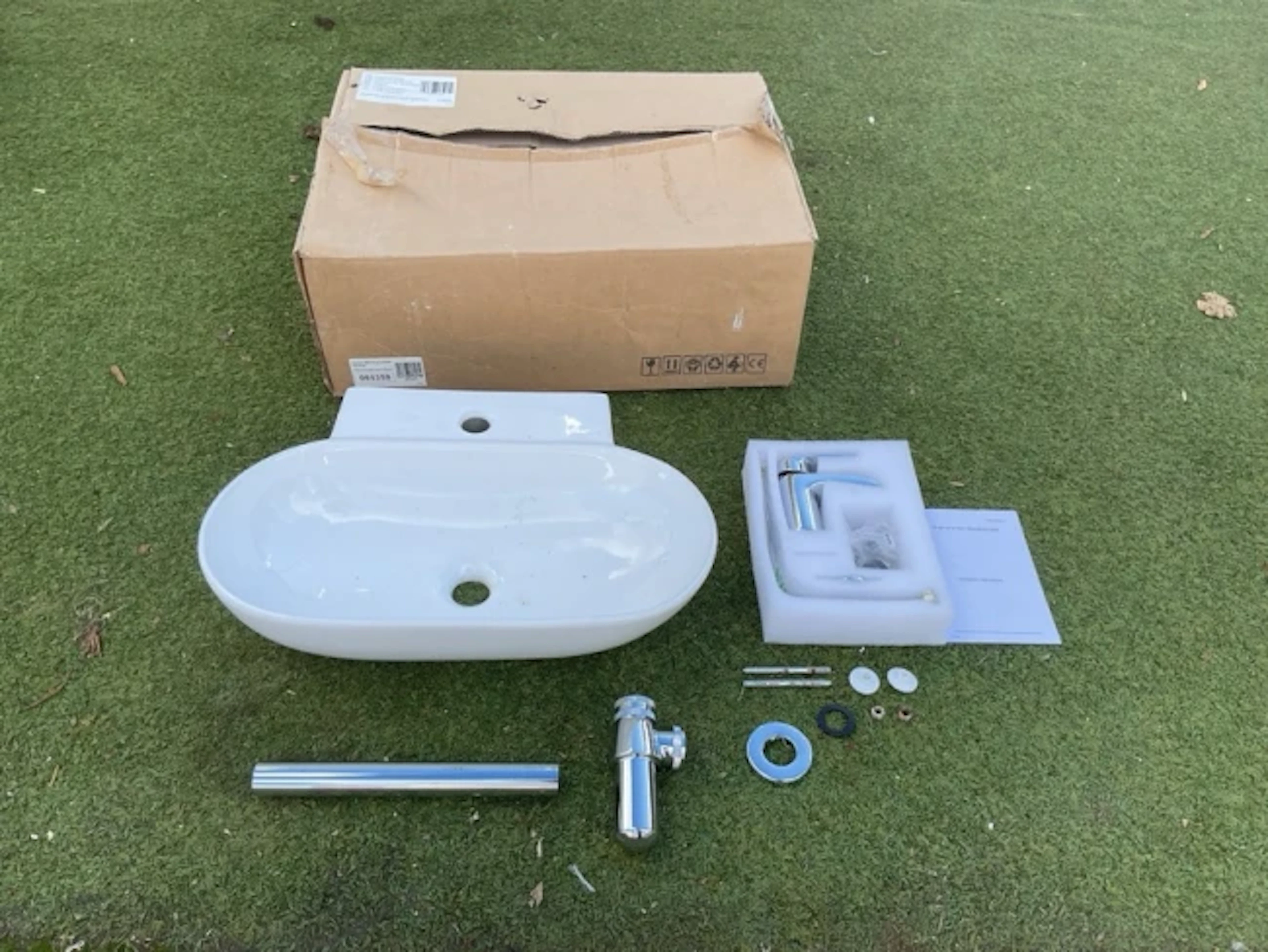 A boxed Milano Overton ceramic sink basin, with chrome mono tap fittings