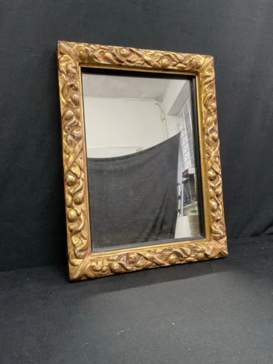 A rectangular Victorian giltwood & gesso Jacobean style mirror with