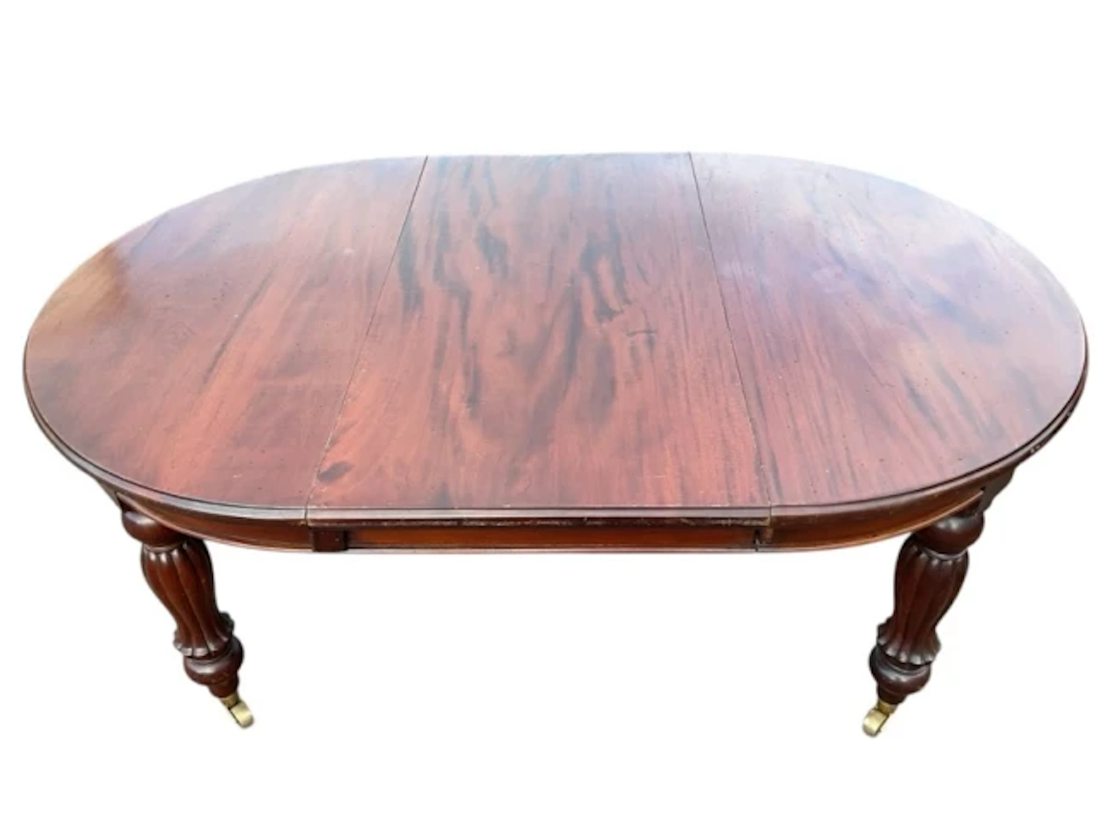 A Victorian style mahogany extending dining table with moulded top