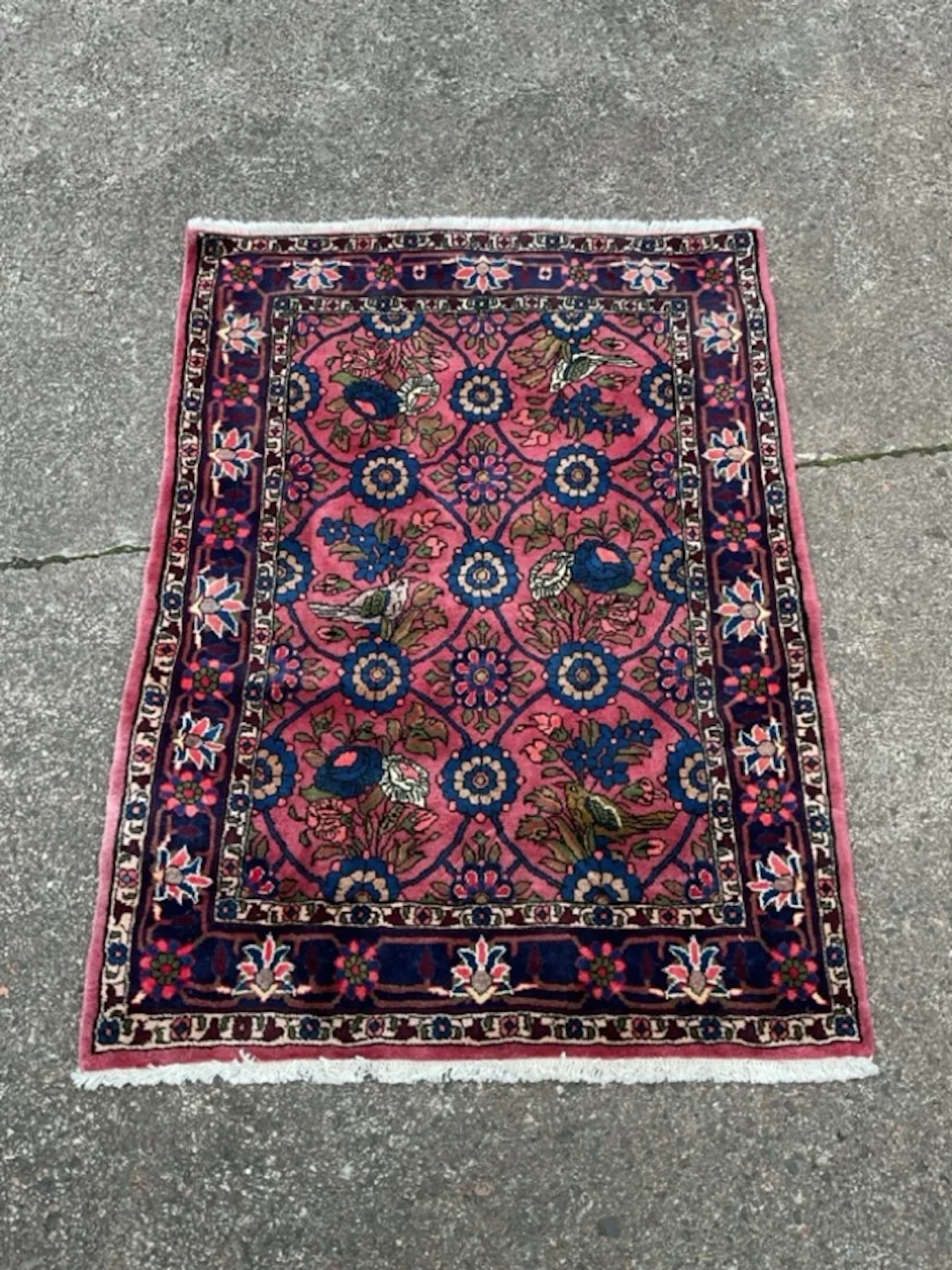 A Persian Veramin rug with interlinked medallions of floral sprays