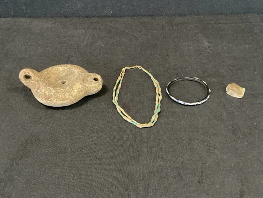 A Roman style redware oil lamp bearing makers mark; a replica glass
