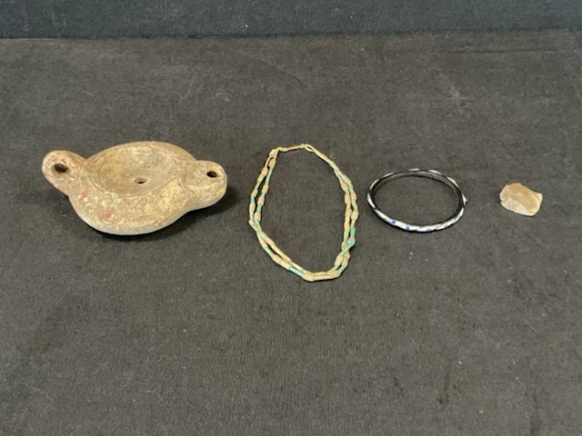 A Roman style redware oil lamp bearing makers mark; a replica glass