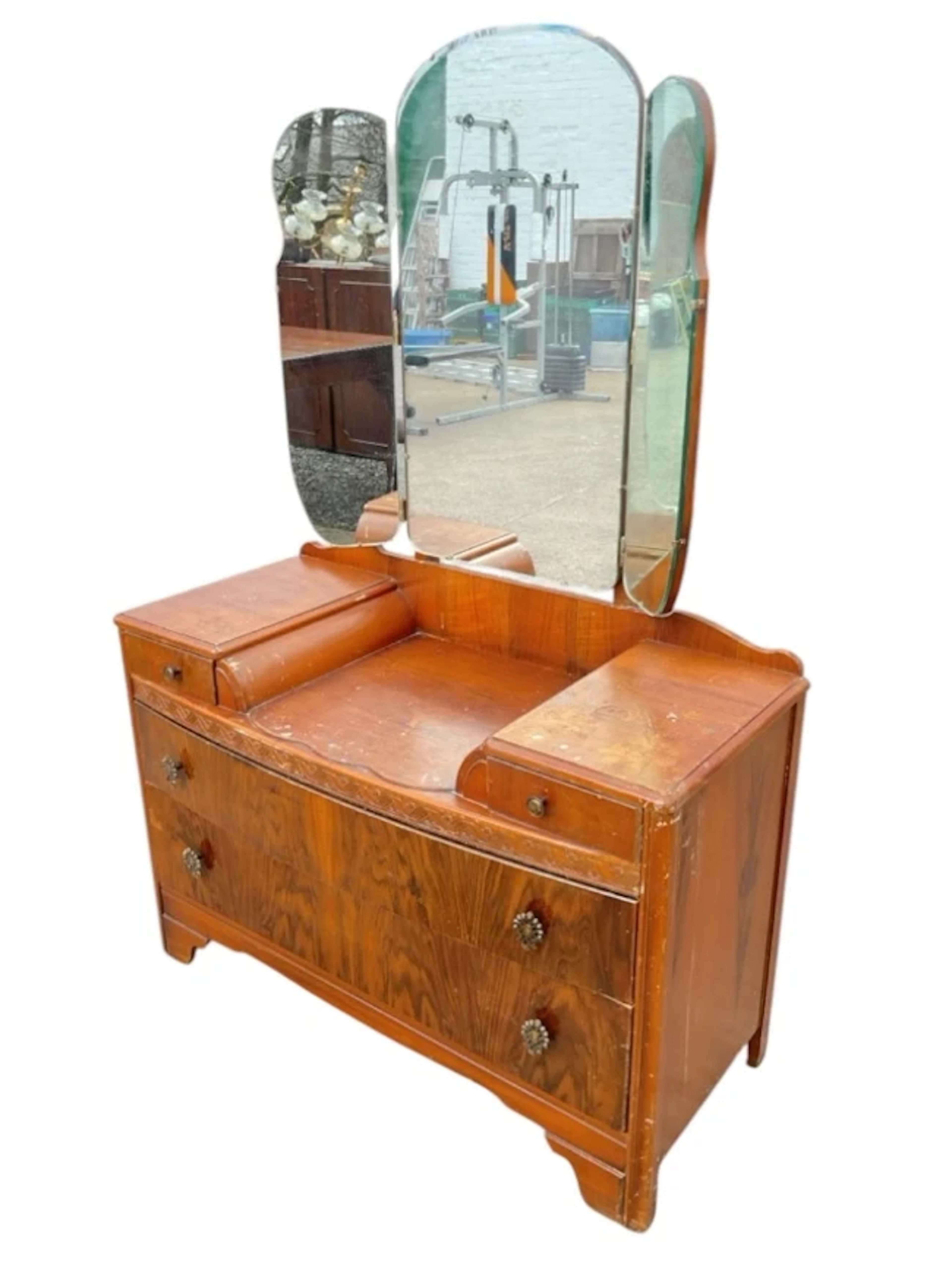 A 50s walnut bowfronted dressing table with arched bevelled mirror