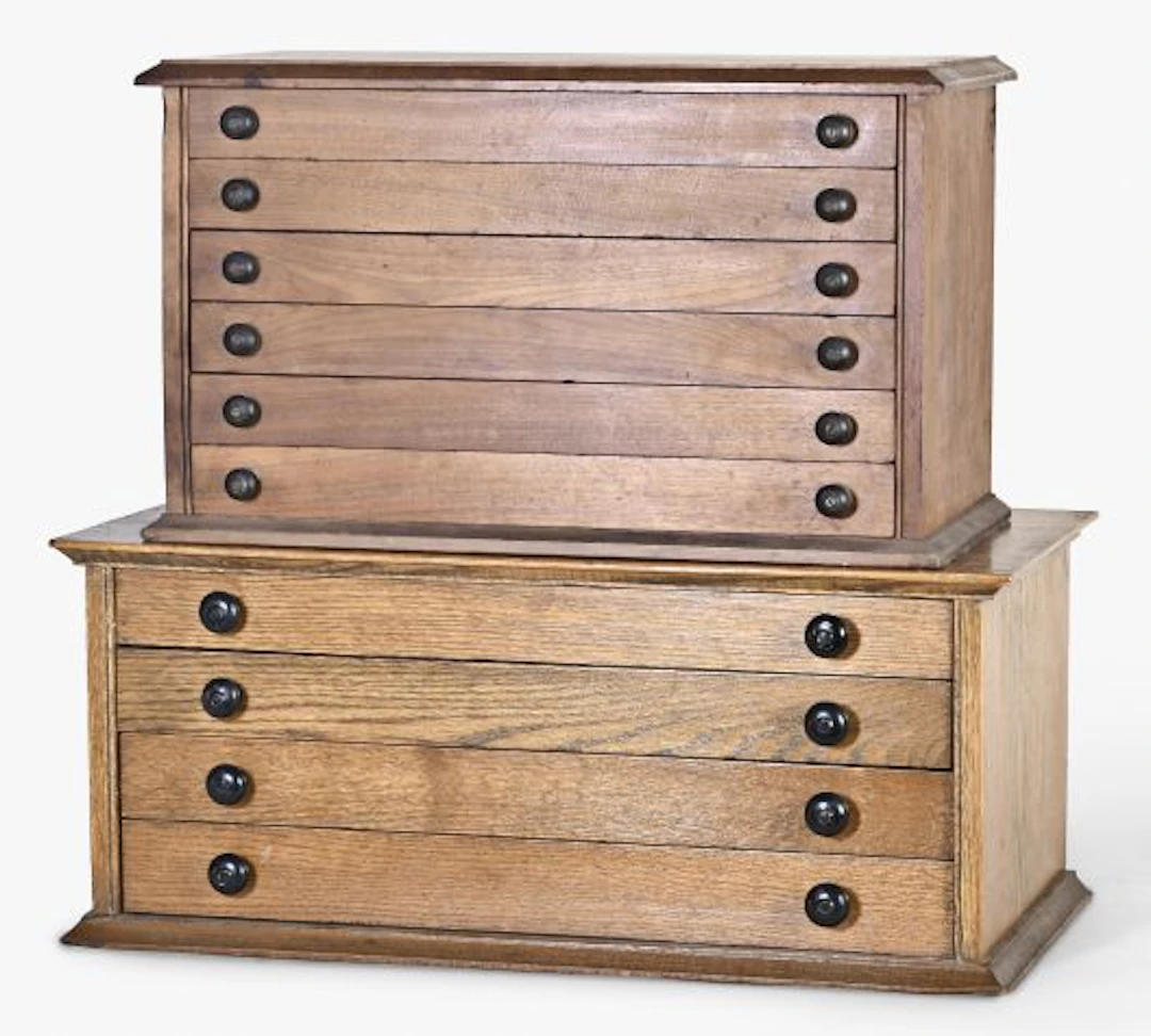 A lot of two watchmaker's crystal cabinets with contents