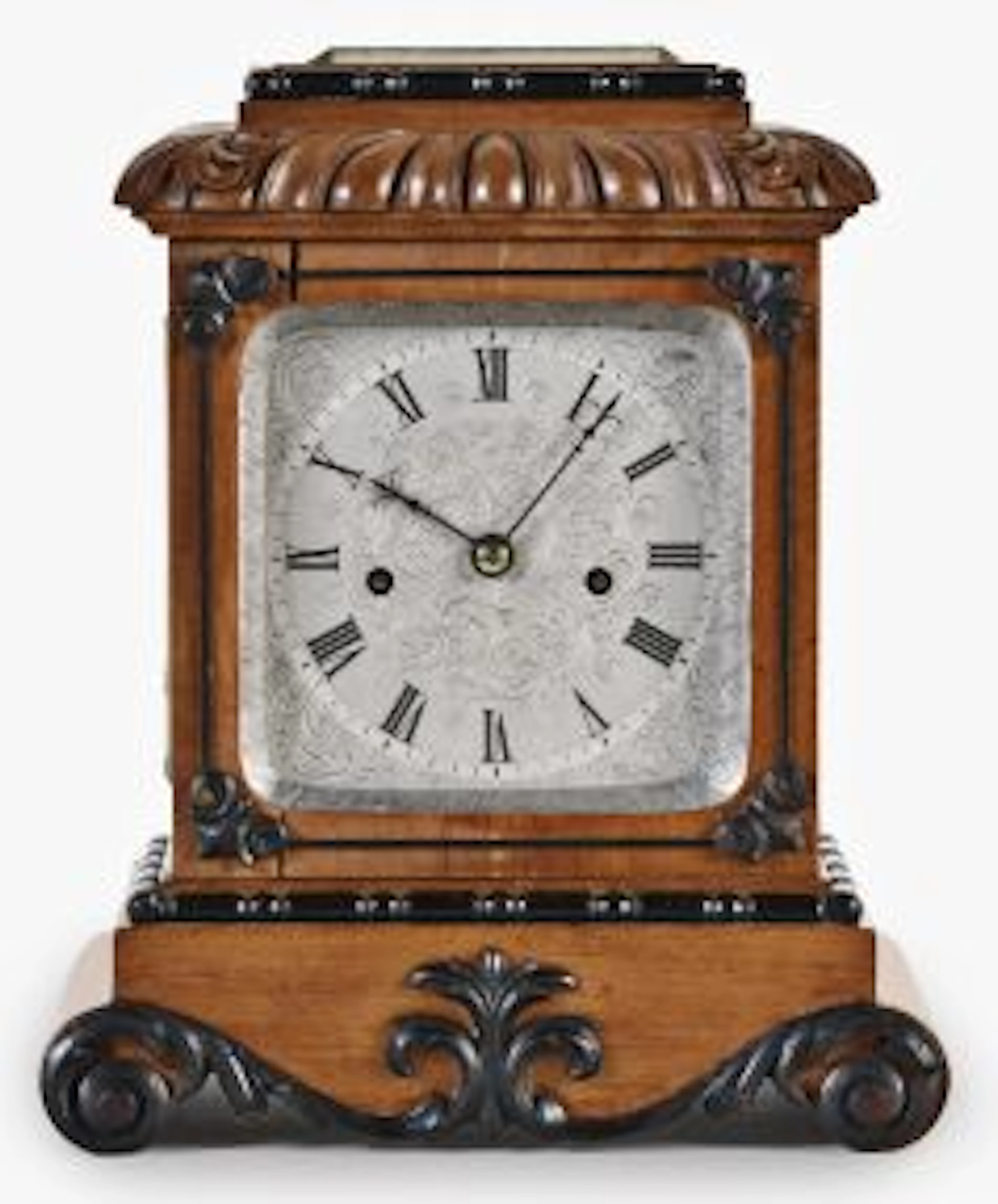 A small, decorative mid 19th century English table or shelf clock by French