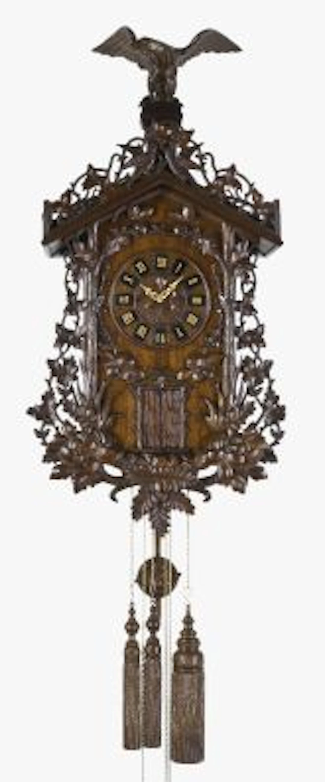 A large late 19th century oak Black Forest two tune hanging trumpeter