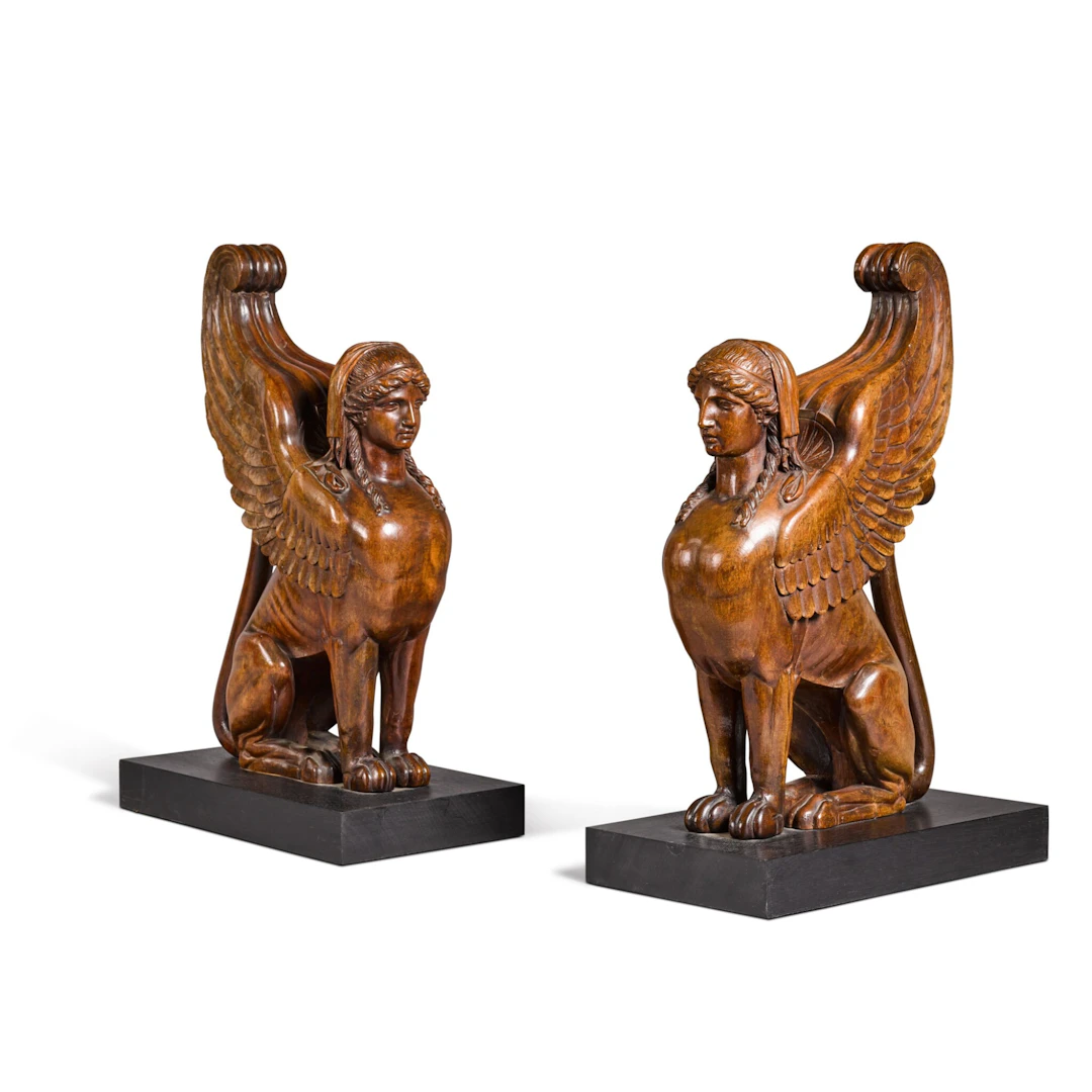 A pair of Empire mahogany griffins, early 19th century