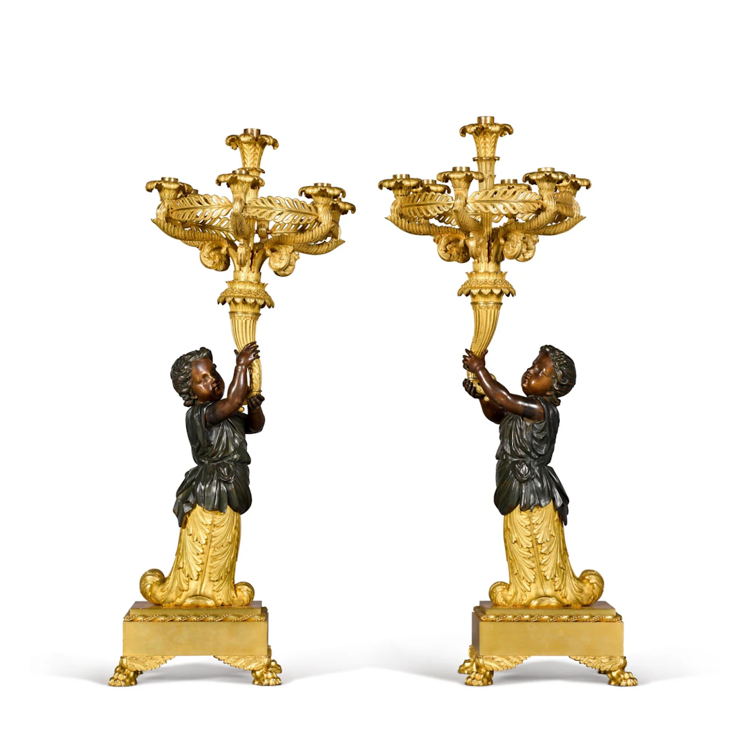 A pair of Napoleon III gilt and patinated bronze figural seven-light