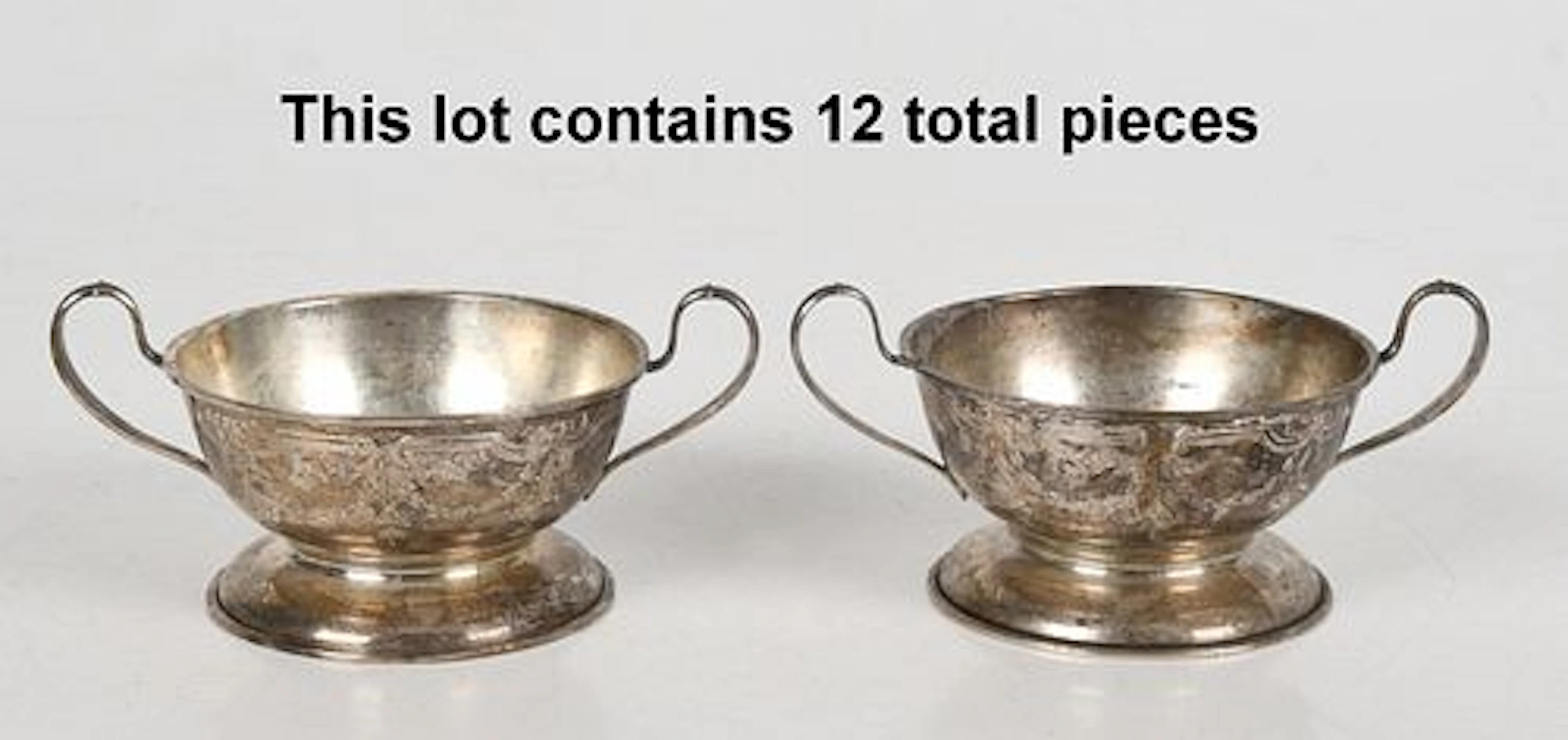A Set of Twelve American Sterling Silver Bouillon Cup Frames, Marked