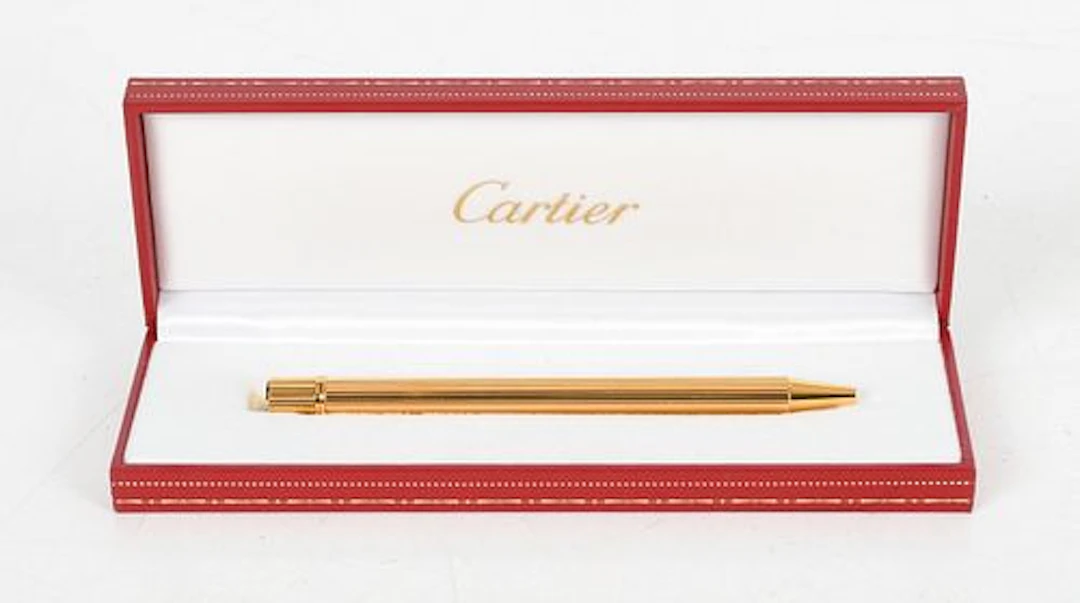A Cartier Gold Plated Must de Cartier Ballpoint Pen and Box