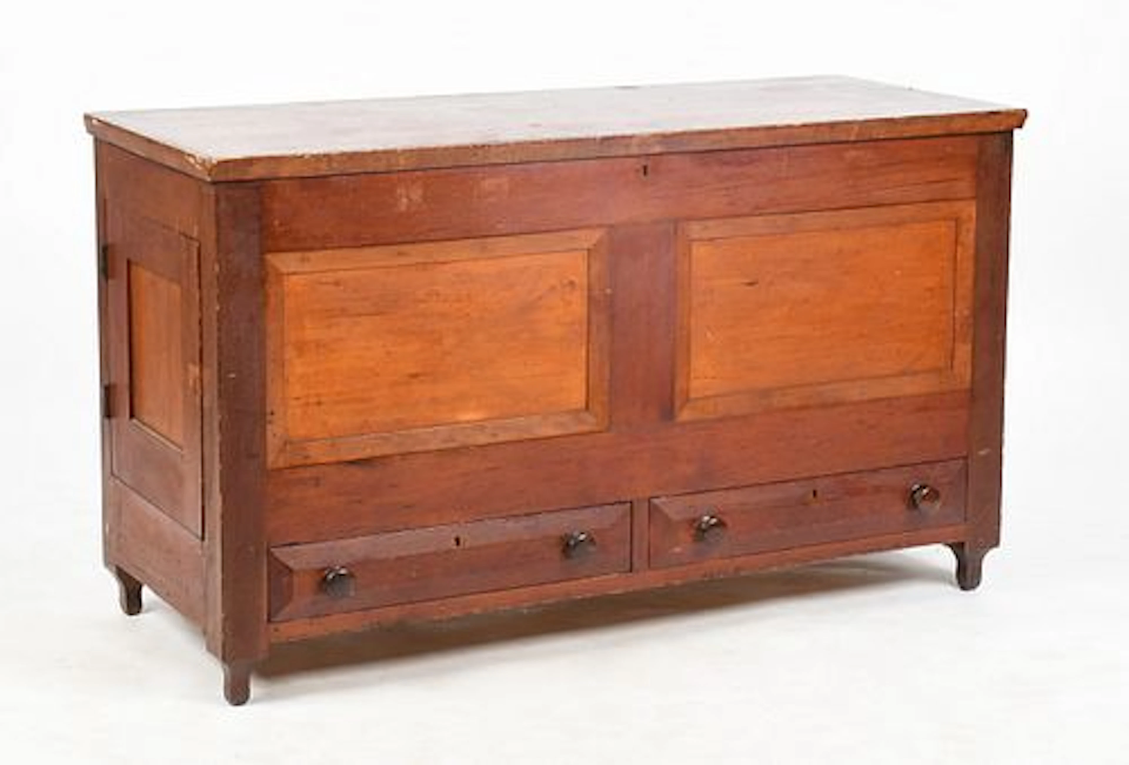 A Paneled Poplar and Cherrywood Blanket Chest over Two Drawers, Probably