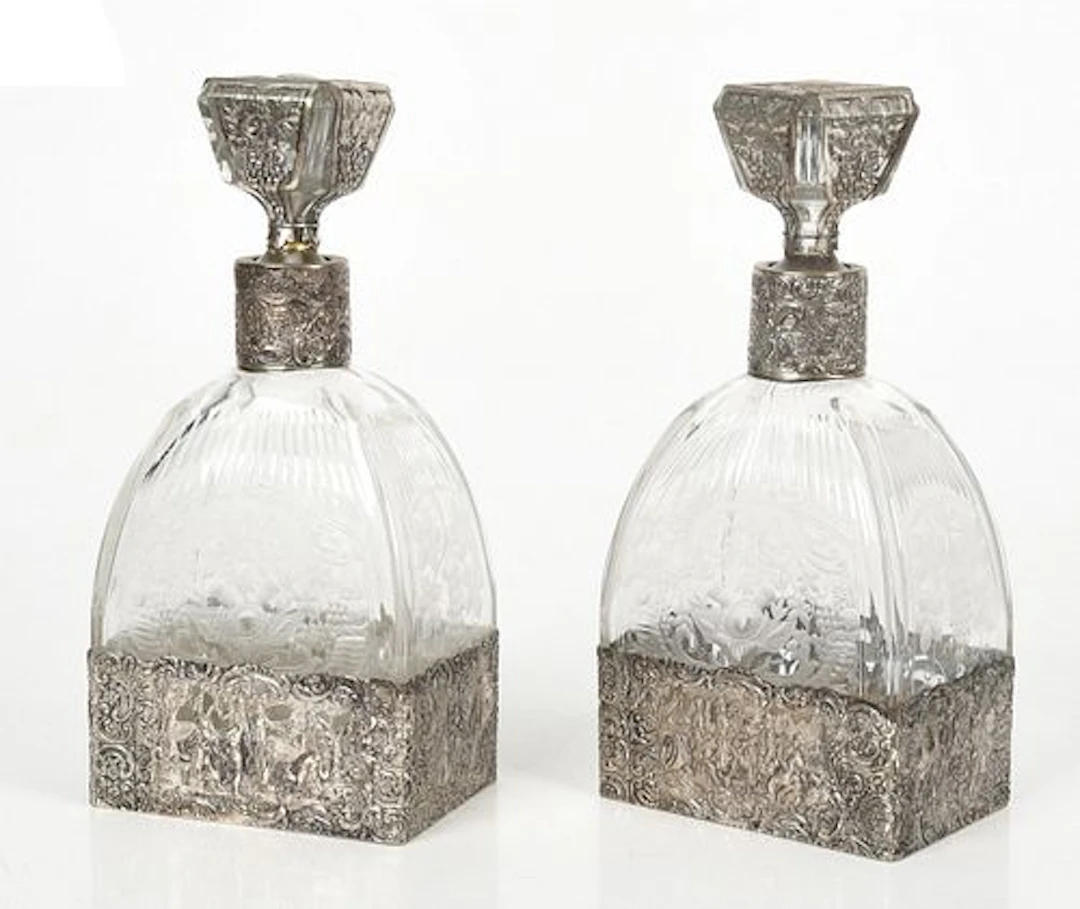 A Pair of Silver Overlay Etched Glass Decanters