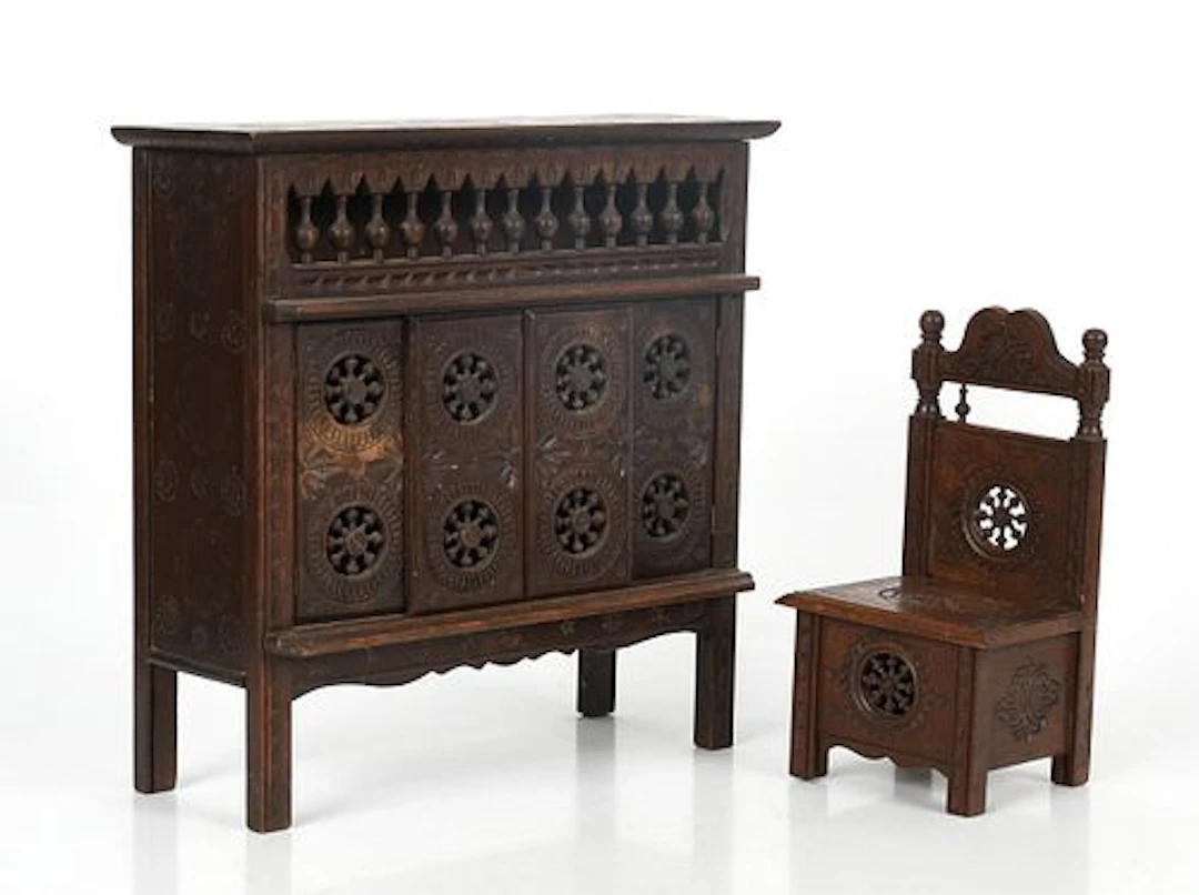 Two Pieces of Stained Oak Stamped and Pierced Miniature Furniture