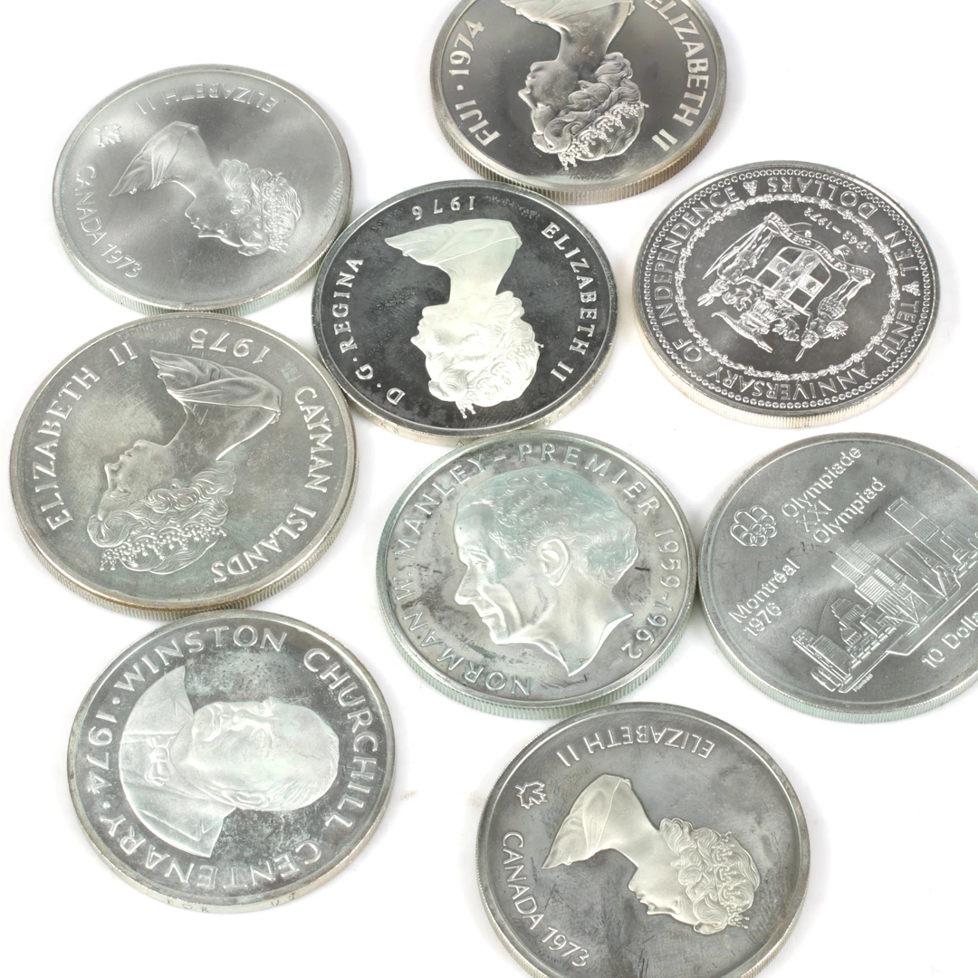 SILVERMYNT. 925/1000, 9 st. bl.a. 50 Dollar, Caymanöarna. 1900-tal.