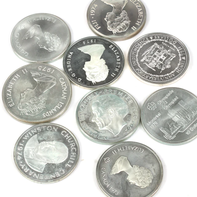 SILVERMYNT. 925/1000, 9 st. bl.a. 50 Dollar, Caymanöarna. 1900-tal.