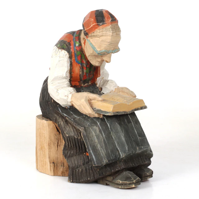 KLAS ANDERSSON. Figurin, Läsande kvinna, skuret och bemålat trä, signerad