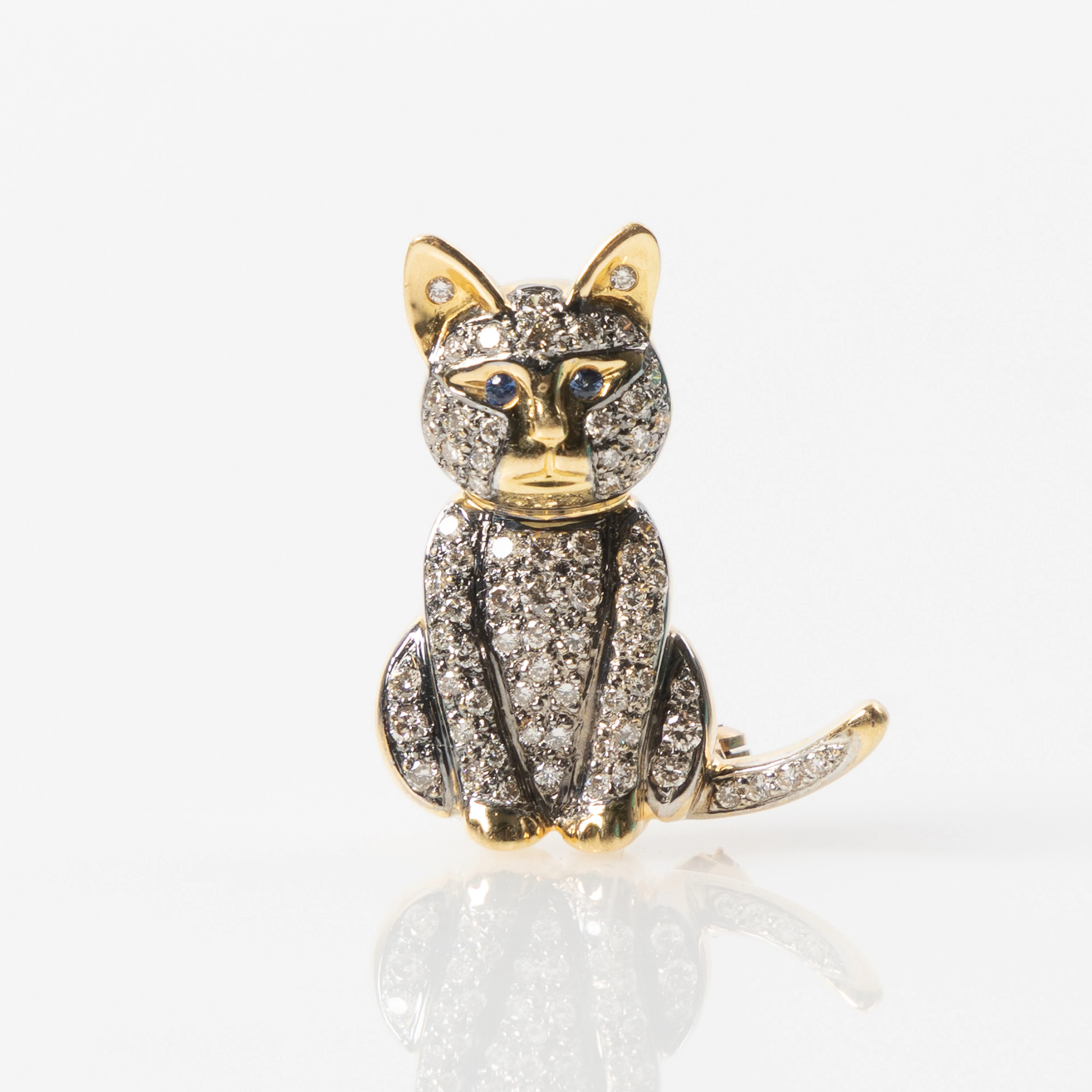 BROSCH, 18K guld och vitguld med briljantslipade diamanter och fasettslipade