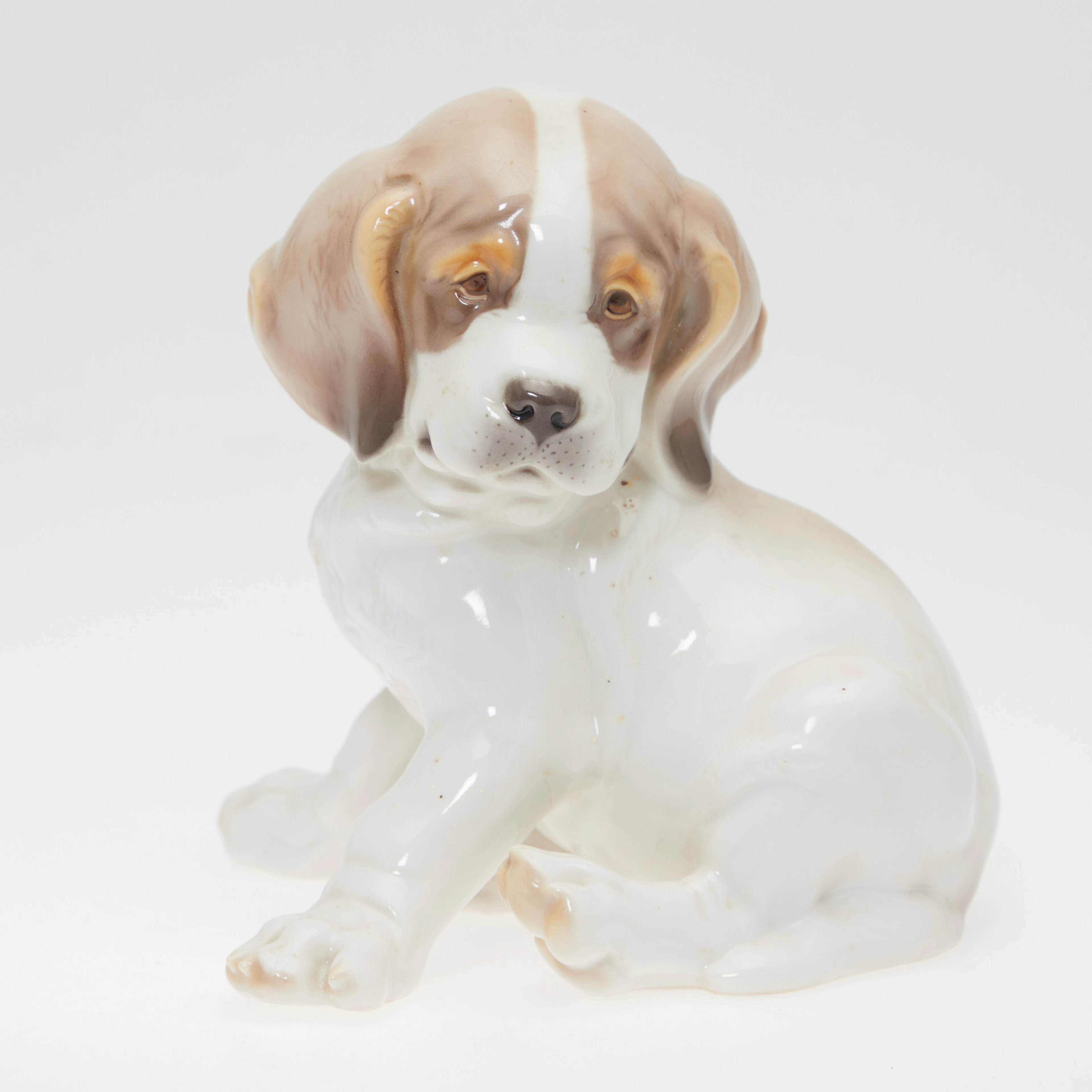 THEODOR KÄRNER, Porzellanfigur eines Hundewelpen, Nymphenburg, 20. Jahrhundert.