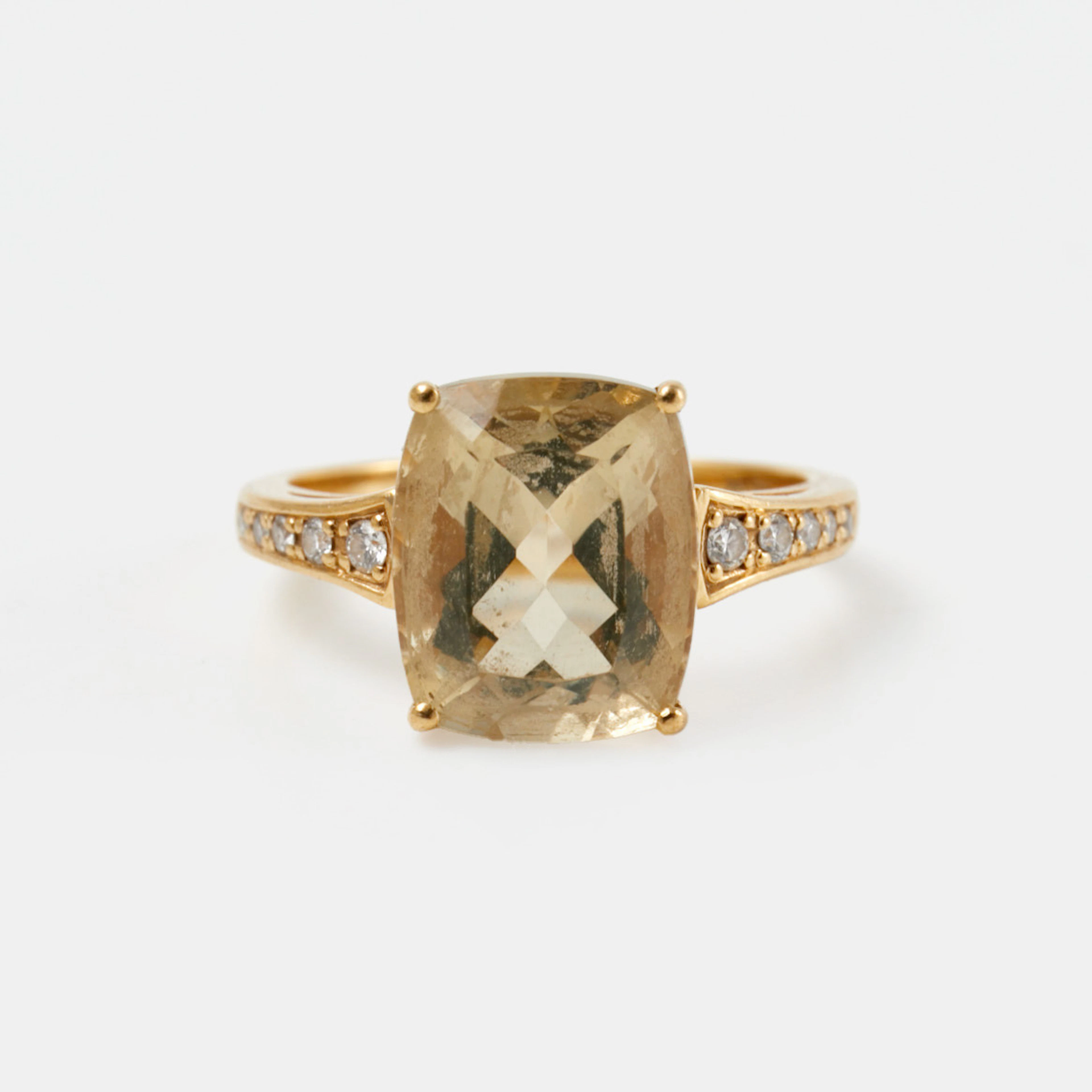 RING, 18 k guld, 1 kuddslipad citrin, flankerad av 10 briljantslipade