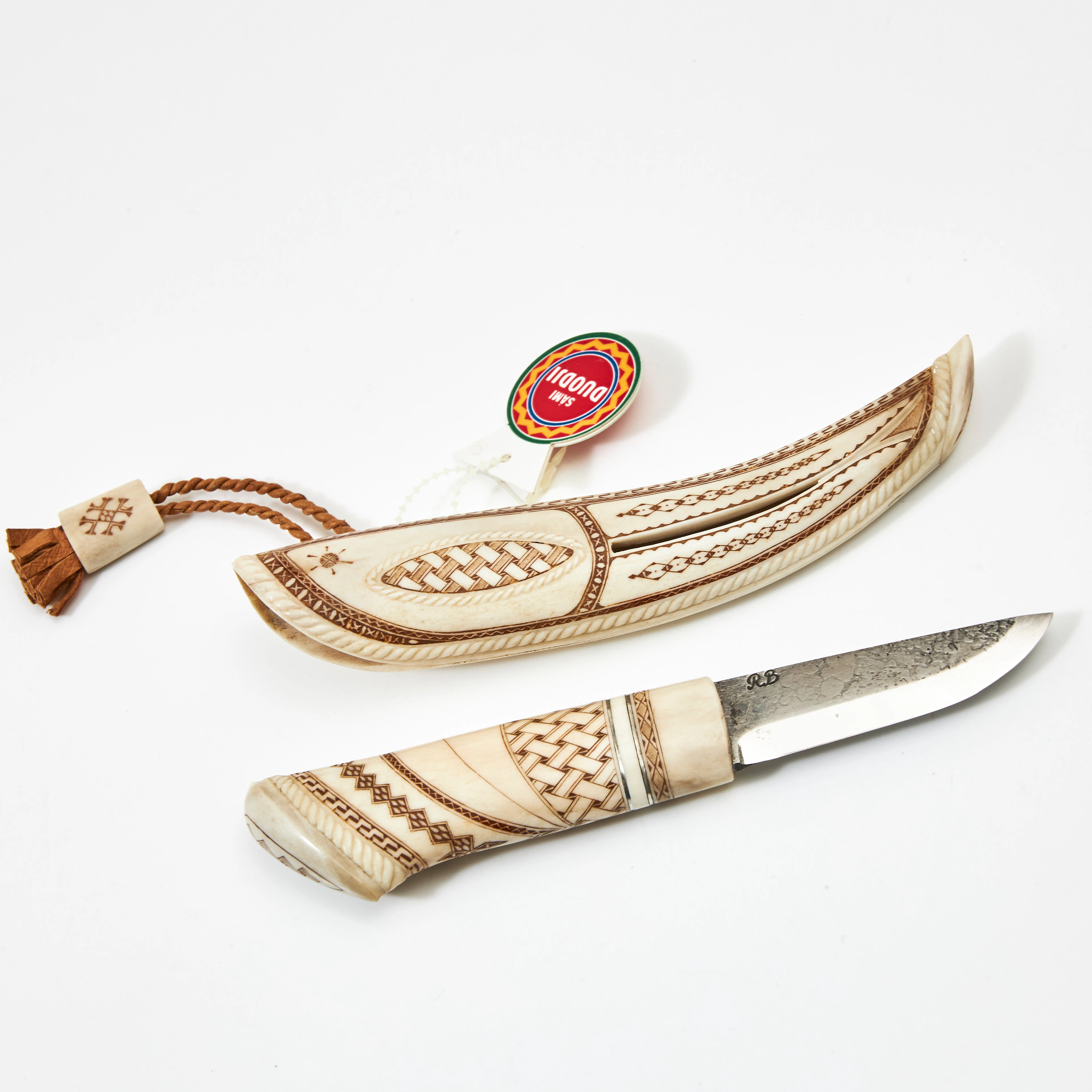OLLE LUNDMARK (1935-2004). Kniv, helhorn, graverat renhorn, genombruten