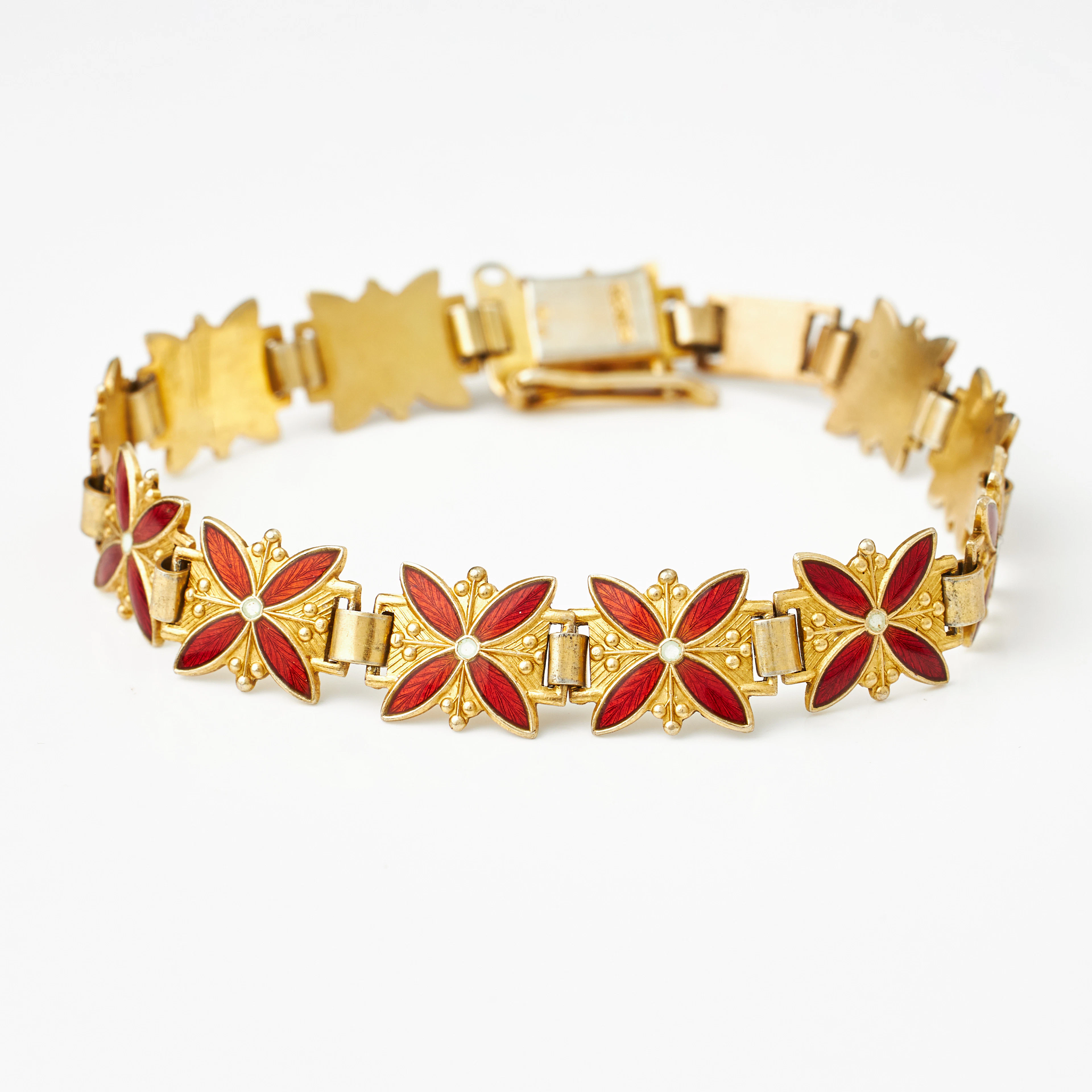 ARMBAND, förgyllt sterlingsilver, sammankopplade stiliserade blommor
